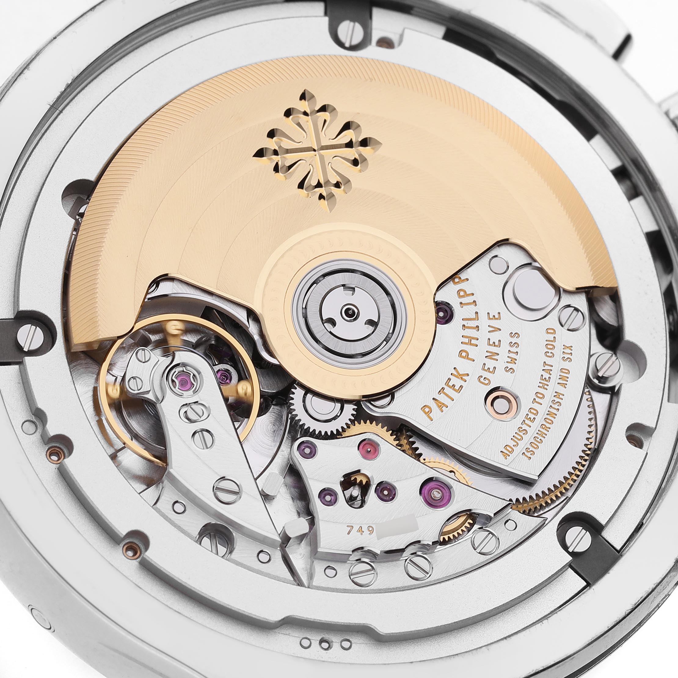 The image shows the intricate movement of a Patek Philippe Complications 5905/1A-001 Men's Stainless Steel Green Dial 5905/1A-001 Men's Stainless Steel Green Dial watch, highlighting the rotor and gear components from a close-up angle.