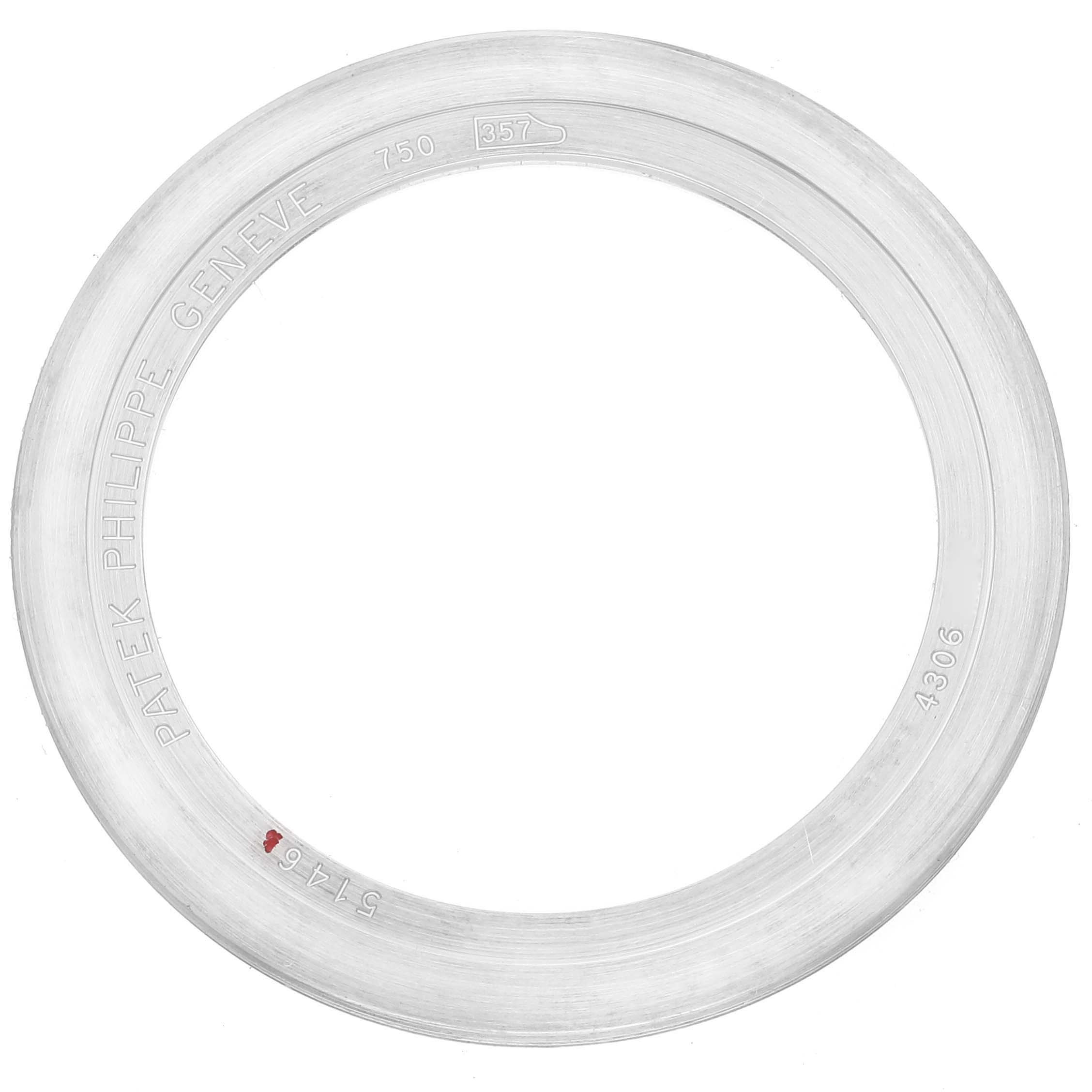 The image shows a close-up of a bezel from a Patek Philippe Complications 5146G Men's White Gold Beige Dial 5146G Men's White Gold Beige Dial watch, displaying markings and engravings.