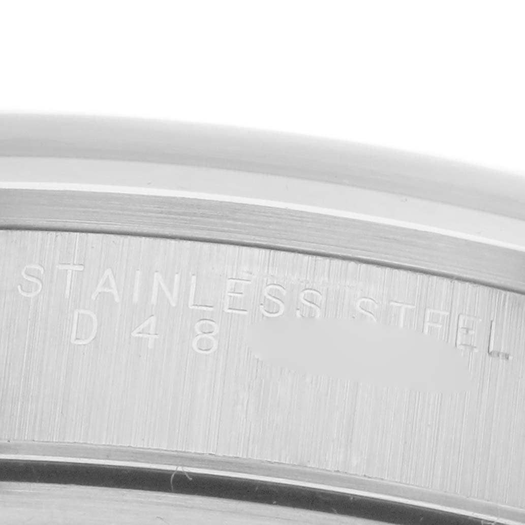 This is a close-up angle of the stainless steel case back of the Rolex Air-King 14000M Men's Stainless Steel Blue Dial 14000M Men's Stainless Steel Blue Dial watch, showing engraved text.