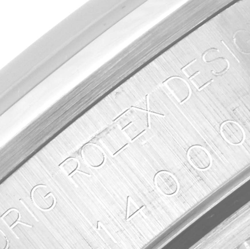 This close-up image shows the engraved serial number and part of the bezel for a Rolex Air-King 14000 Men's Stainless Steel Black Dial 14000 Men's Stainless Steel Black Dial watch.
