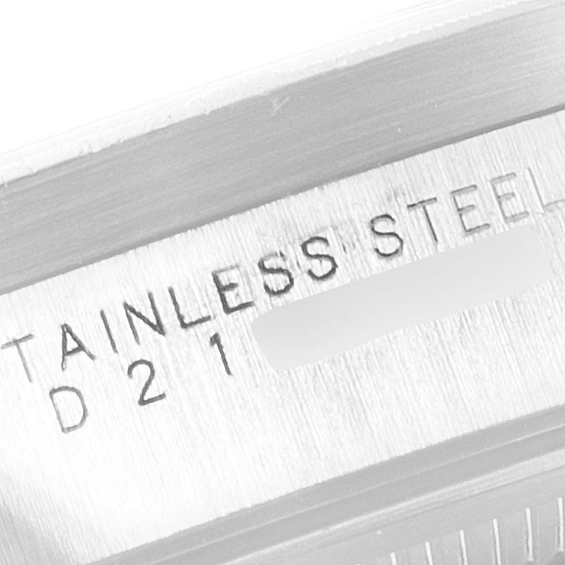 This is a close-up image showing the "STAINLESS STEEL" engraving on a Rolex Air-King 14010 Men's Stainless Steel Silver Dial 14010 Men's Stainless Steel Silver Dial watch.