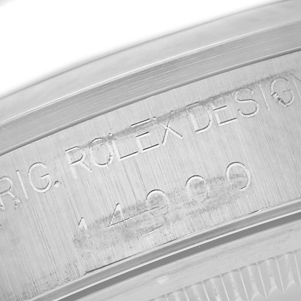 This image shows a close-up of the engraved model number on the Rolex Air-King 14000 Men's Stainless Steel Silver Dial 14000 Men's Stainless Steel Silver Dial watch bezel.