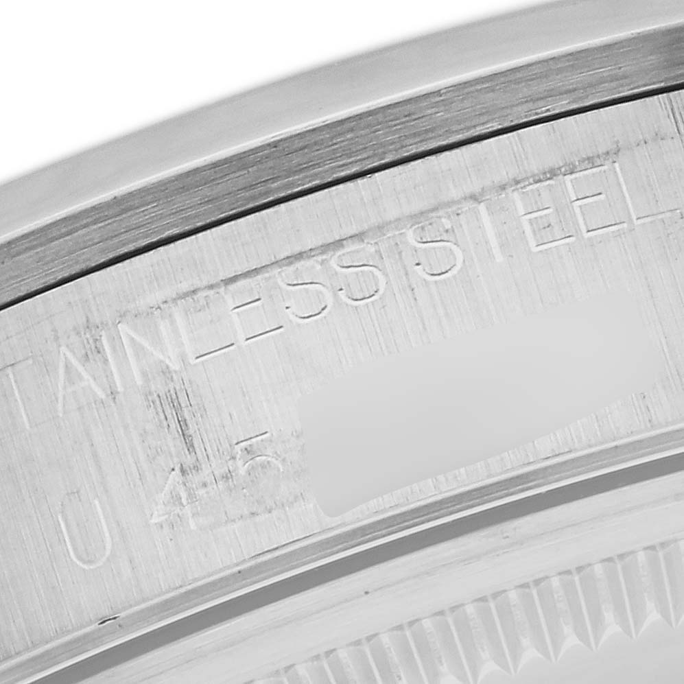 The image shows a close-up of the side of the case of a Rolex Air-King 14000 Men's Stainless Steel Silver Dial 14000 Men's Stainless Steel Silver Dial watch, focusing on the stainless steel engravings.