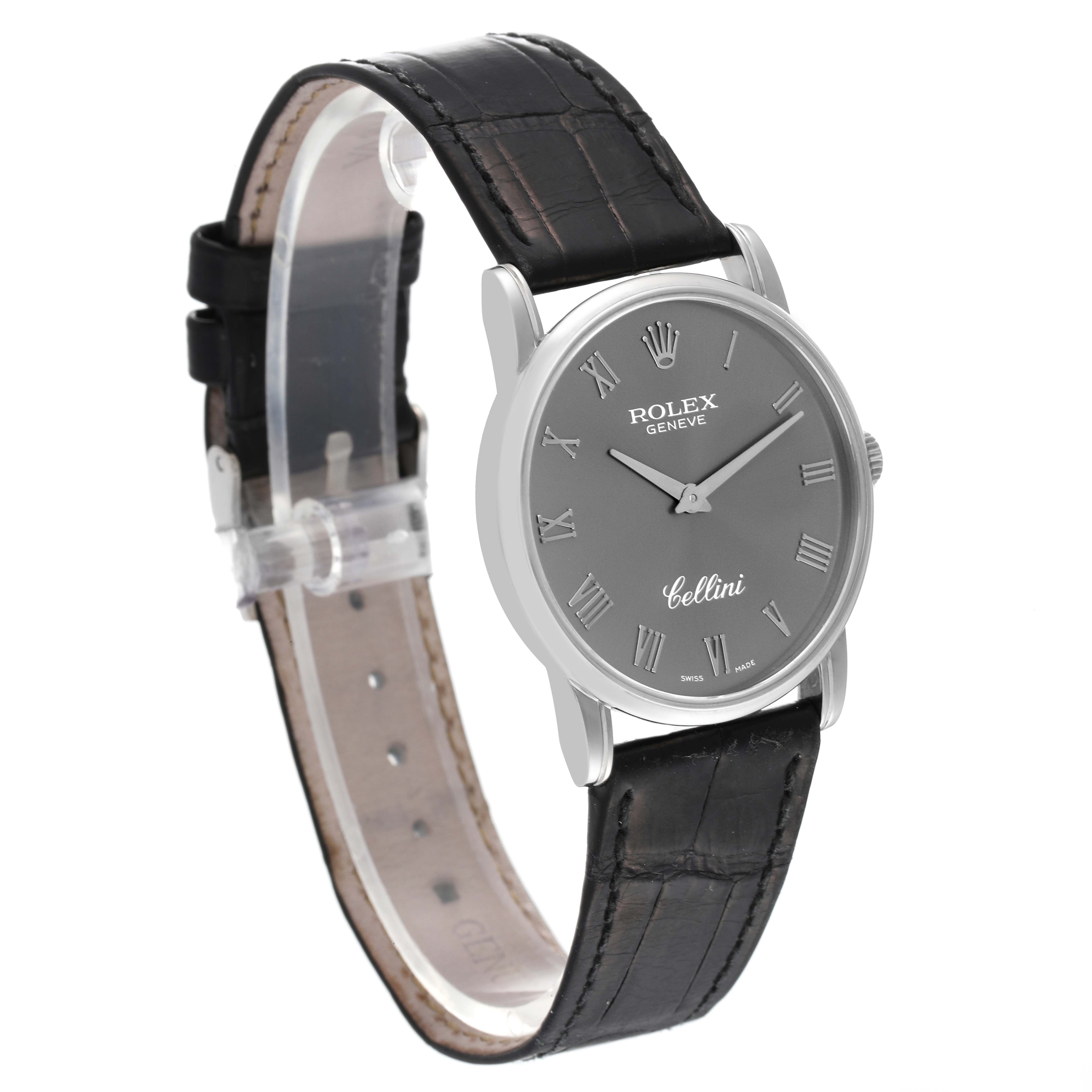 The image shows a side-angle view of a Rolex Cellini 5116 Men
s Stainless Steel Grey Dial 5116 Men
s Stainless Steel Grey Dial watch, highlighting its black leather strap and grey dial with Roman numerals.