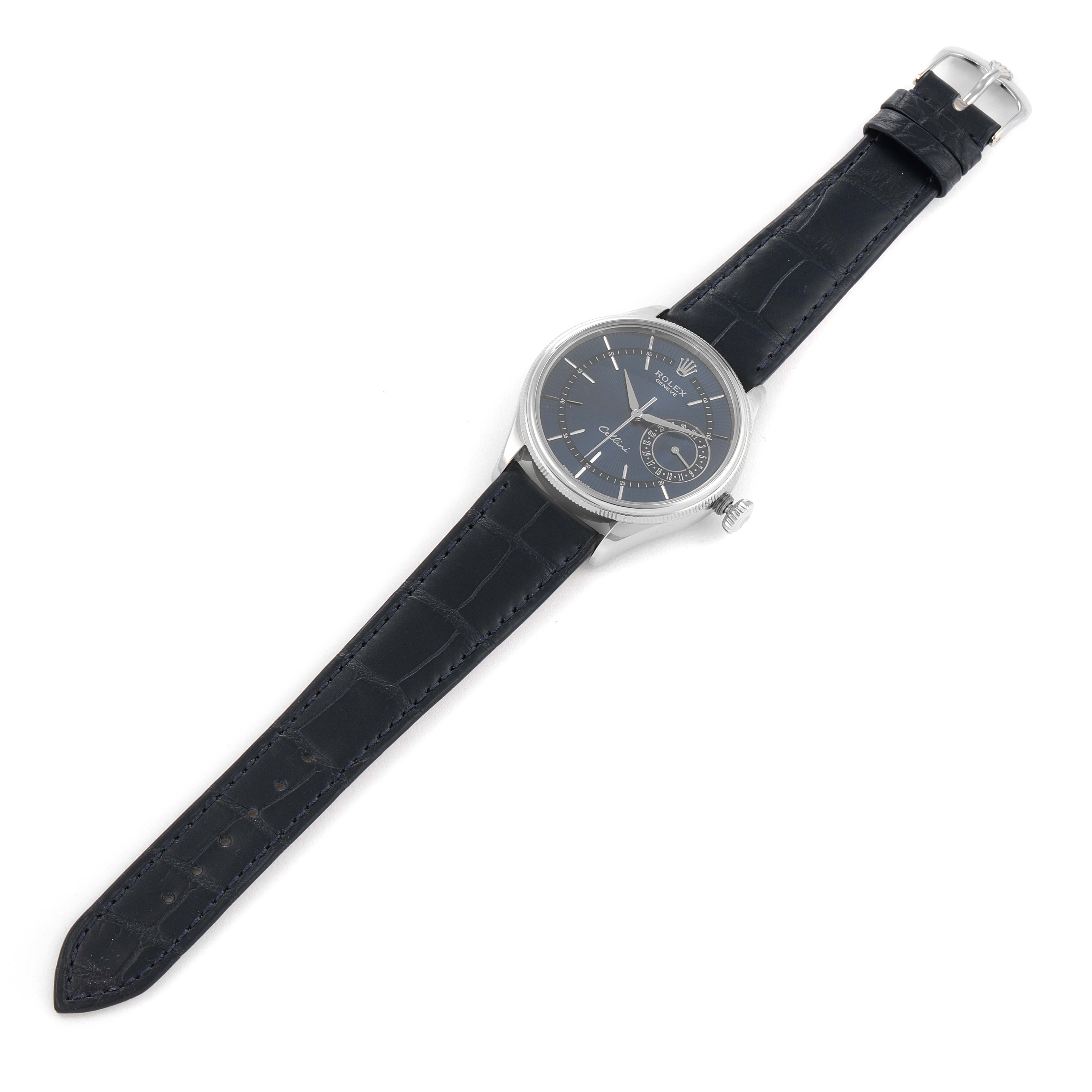 The image shows a top view of a Rolex Cellini 50519 Men's White Gold Blue Dial 50519 Men's White Gold Blue Dial watch, featuring its black leather strap and circular watch face.