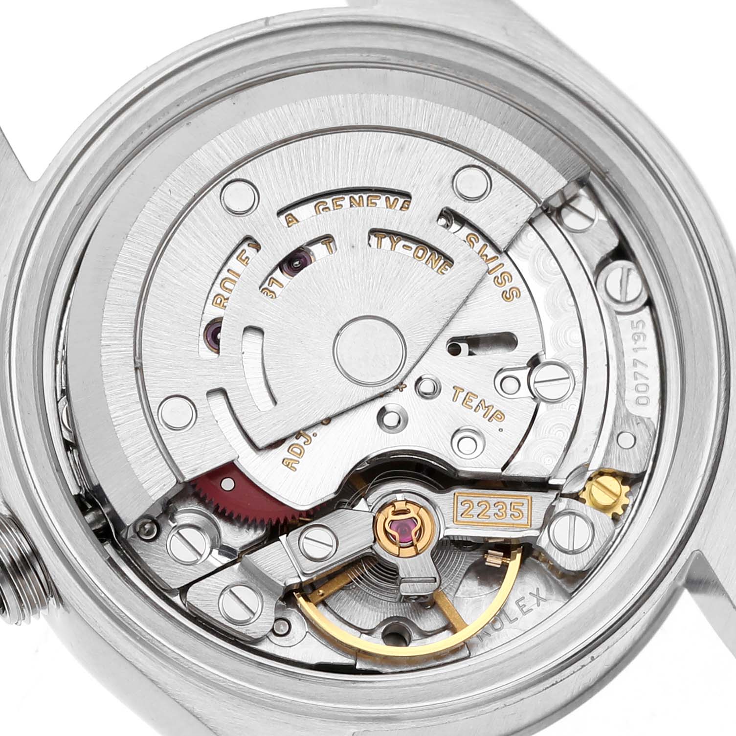 The image shows the movement of a Rolex Date 79240 Women's Stainless Steel Black Dial 79240 Women's Stainless Steel Black Dial model focusing on the rotor and visible gears from a rear angle.