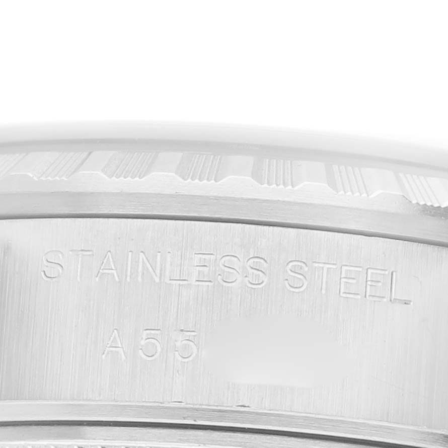 The image shows a close-up of the side of a Rolex Date 79240 Women's Stainless Steel Black Dial 79240 Women's Stainless Steel Black Dial, focusing on the stainless steel engraving.