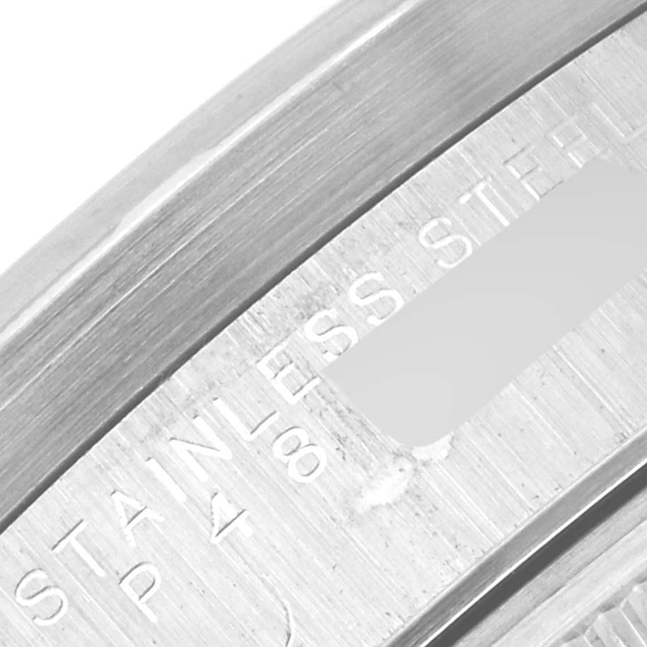 The image shows a close-up angle of the inner bezel with engraving details of a Rolex Date 15210 Men's Stainless Steel Black Dial 15210 Men's Stainless Steel Black Dial model watch.
