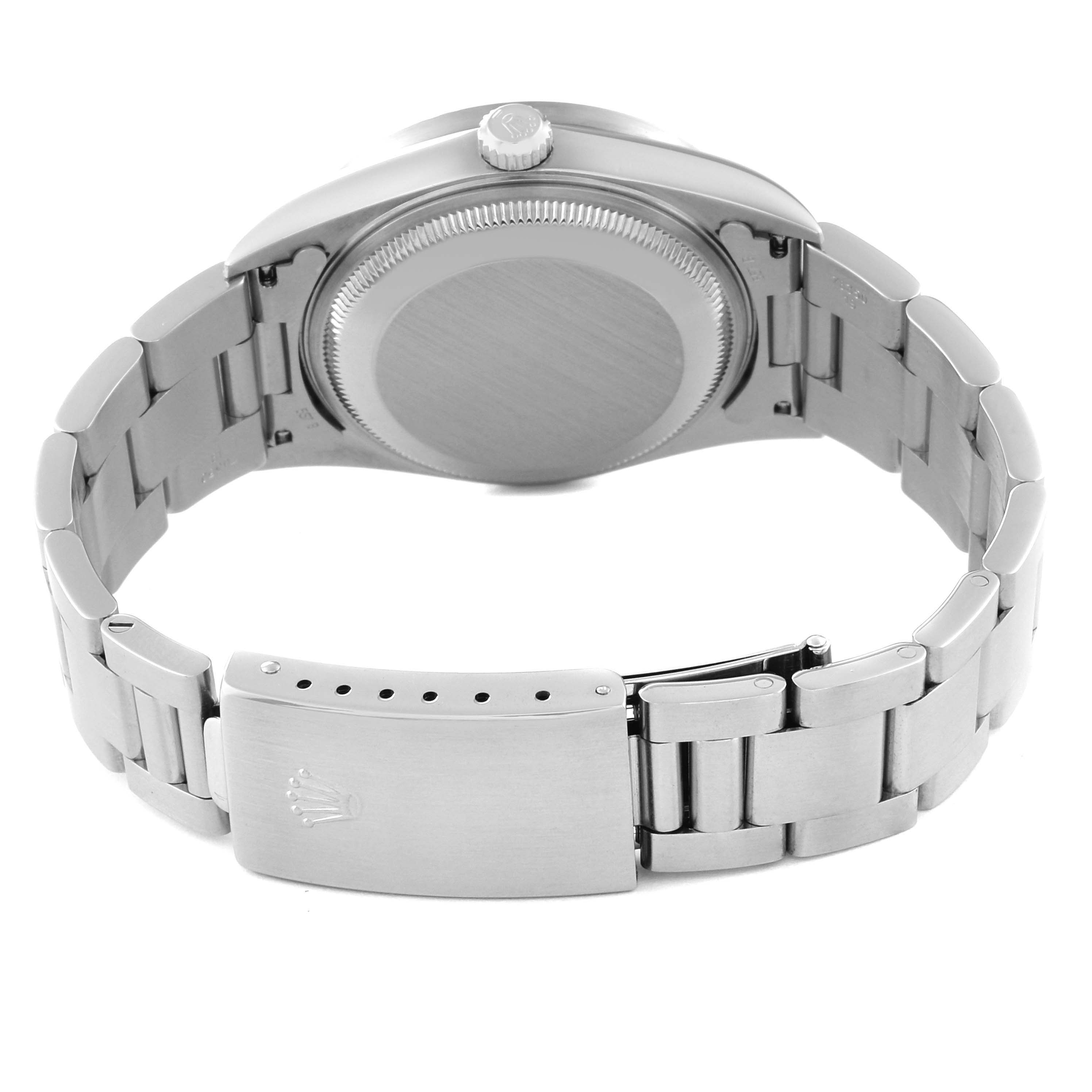 The image shows the back of a Rolex Date 15210 Men's Stainless Steel Black Dial 15210 Men's Stainless Steel Black Dial model watch, focusing on the case back, crown, and clasp of the bracelet.