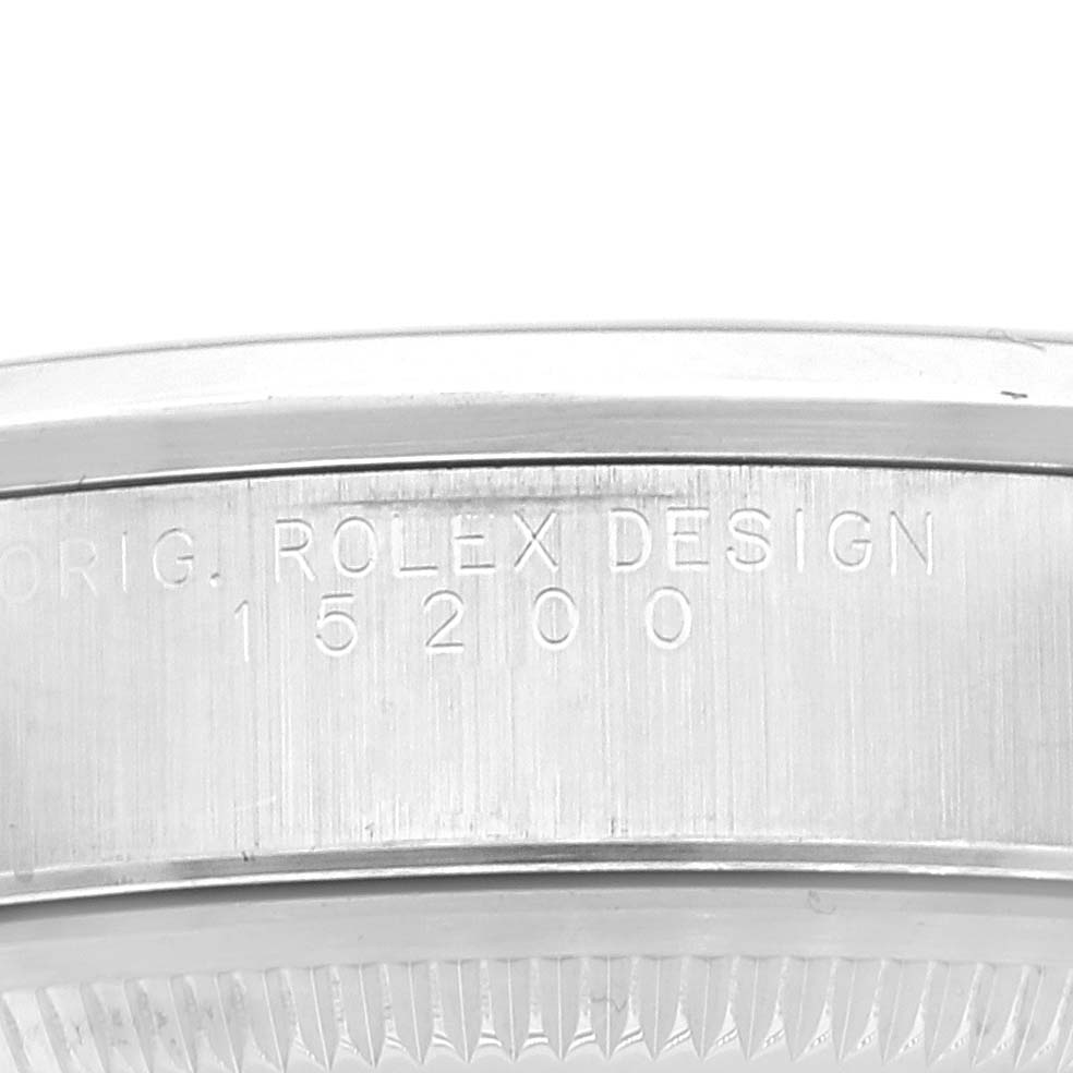 This image shows the case side and bezel of a Rolex Date 15200 Men's Stainless Steel Blue Dial 15200 Men's Stainless Steel Blue Dial model, with "ROLEX DESIGN" and the model number engraved.