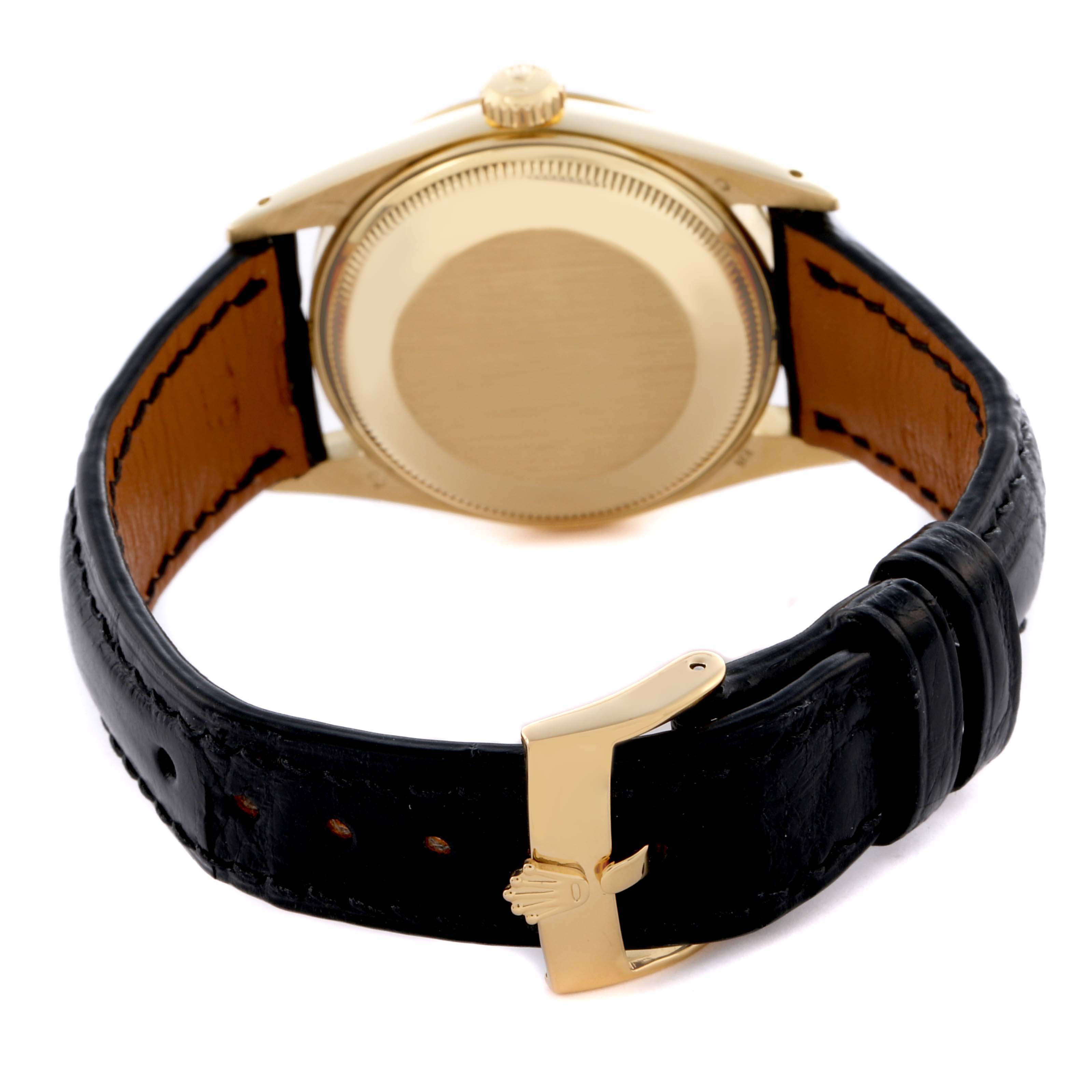 The image shows the back of a Rolex Date 15037 Men's Yellow Gold Champagne Dial 15037 Men's Yellow Gold Champagne Dial watch with a focus on the case, crown, and leather strap.