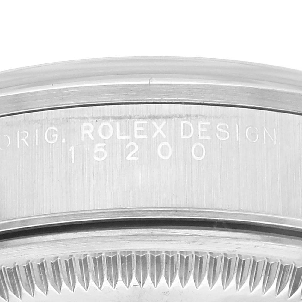This image shows a close-up of the side of the case of a Rolex Date 15200 Men's Stainless Steel Silver Dial 15200 Men's Stainless Steel Silver Dial model, displaying the "ROLEX DESIGN" engraving and reference number.
