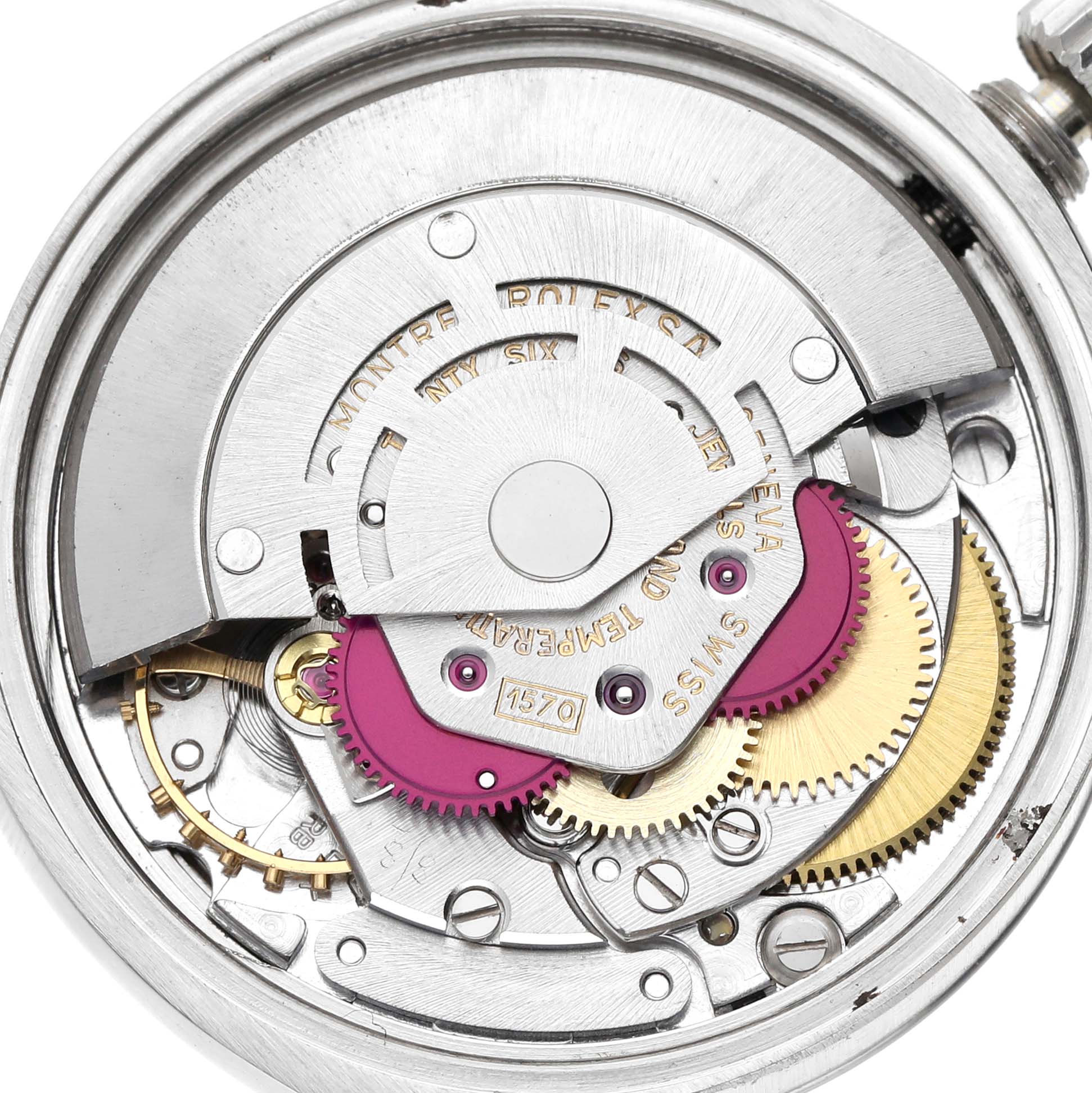 The image shows the movement from the back, revealing gears and mechanisms of the Rolex Date 68587 Men's Stainless Steel Silver Dial 68587 Men's Stainless Steel Silver Dial model.