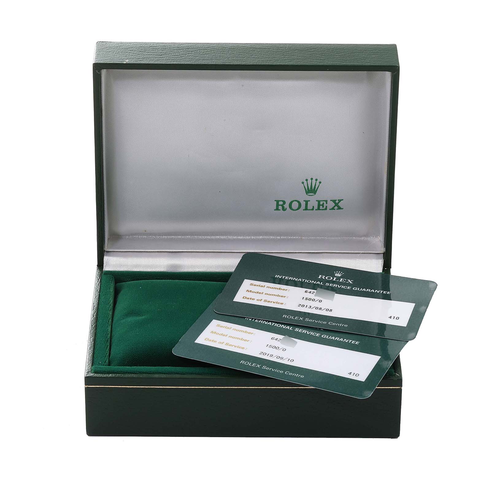 This image shows an open Rolex Vintage Collection 1500 Men
s Stainless Steel Silver Dial 1500 Men
s Stainless Steel Silver Dial watch box containing guarantee cards.