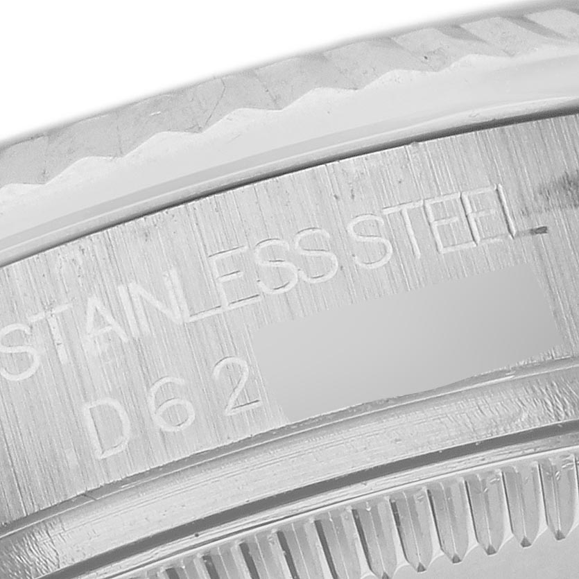 The image shows a close-up of the side engraving and bezel of a Rolex Mid-Size 178274 Women's Stainless Steel Mother of Pearl Dial 178274 Women's Stainless Steel Mother of Pearl Dial watch, highlighting "STAINLESS STEEL."