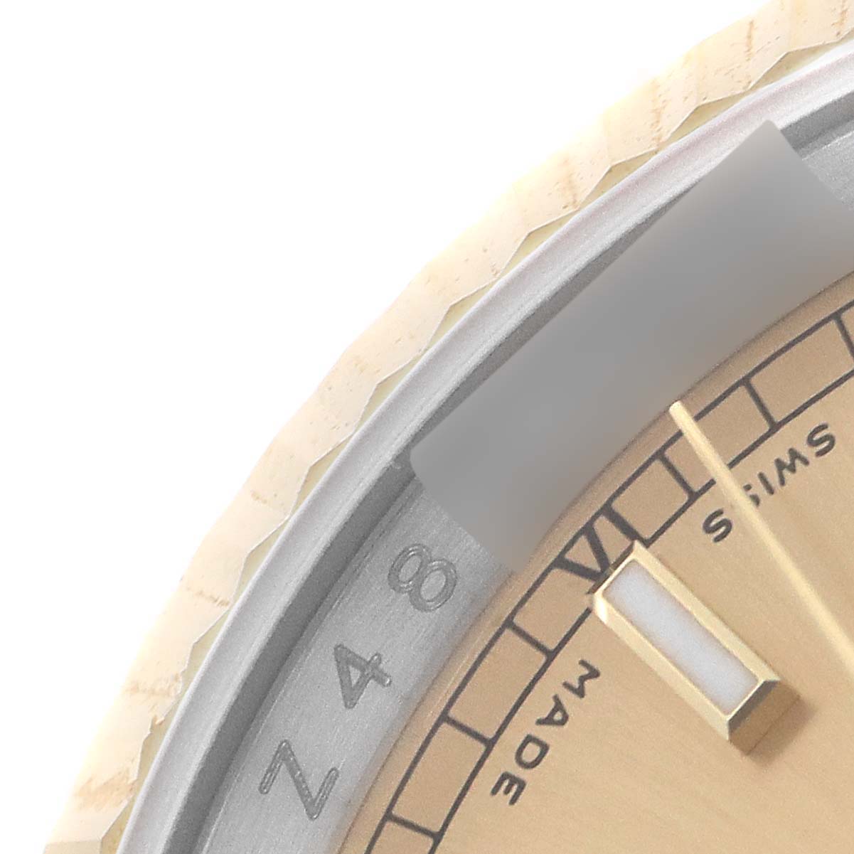 This close-up image shows the dial, part of the bezel, and hour markers of a Rolex Datejust 116233 Men's Steel and Gold (two tone) Champagne Dial 116233 Men's Steel and Gold (two tone) Champagne Dial watch.