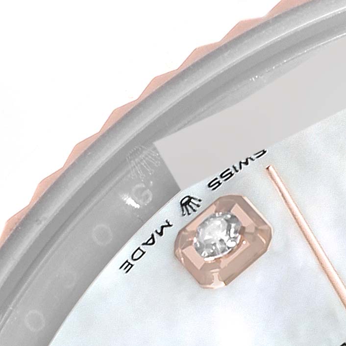 The image shows a close-up of the dial edge and a diamond hour marker on a Rolex Datejust 41 126331 Men's Steel and Gold (two tone) Mother of Pearl Dial 126331 Men's Steel and Gold (two tone) Mother of Pearl Dial watch.