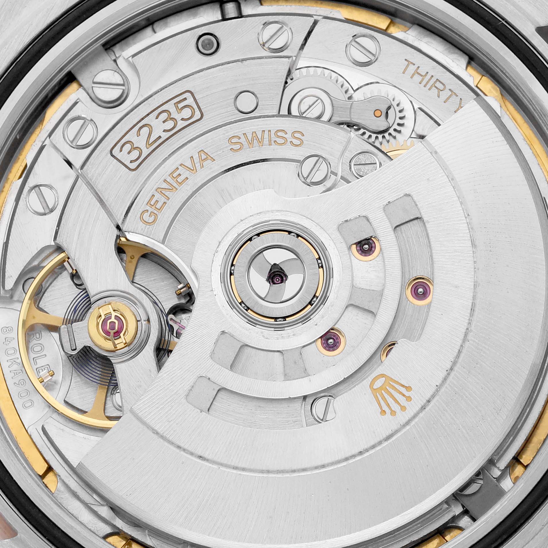This close-up image shows the internal mechanism of the Rolex Datejust 41 126331 Men's Steel and Gold (two tone) Mother of Pearl Dial 126331 Men's Steel and Gold (two tone) Mother of Pearl Dial model, including the rotor and movement components.