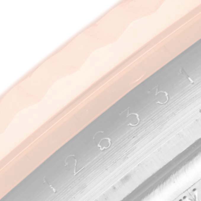 The image shows a close-up angle of the engraved edge of a Rolex Datejust 41 126331 Men's Steel and Gold (two tone) Mother of Pearl Dial watch, focusing on the serial number or reference number area.