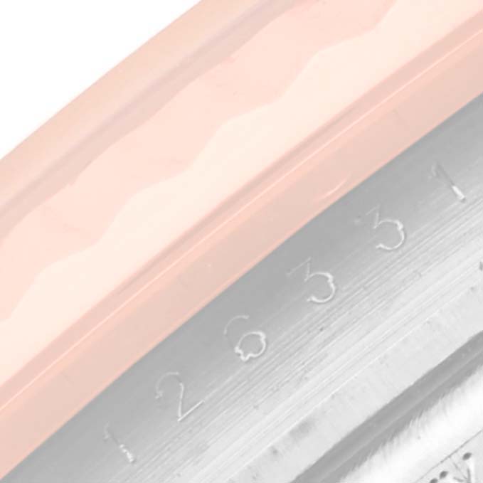 The close-up image shows part of the bezel and engraved numbers of a Rolex Datejust 41 126331 Men's Steel and Gold (two tone) Mother of Pearl Dial 126331 Men's Steel and Gold (two tone) Mother of Pearl Dial watch.