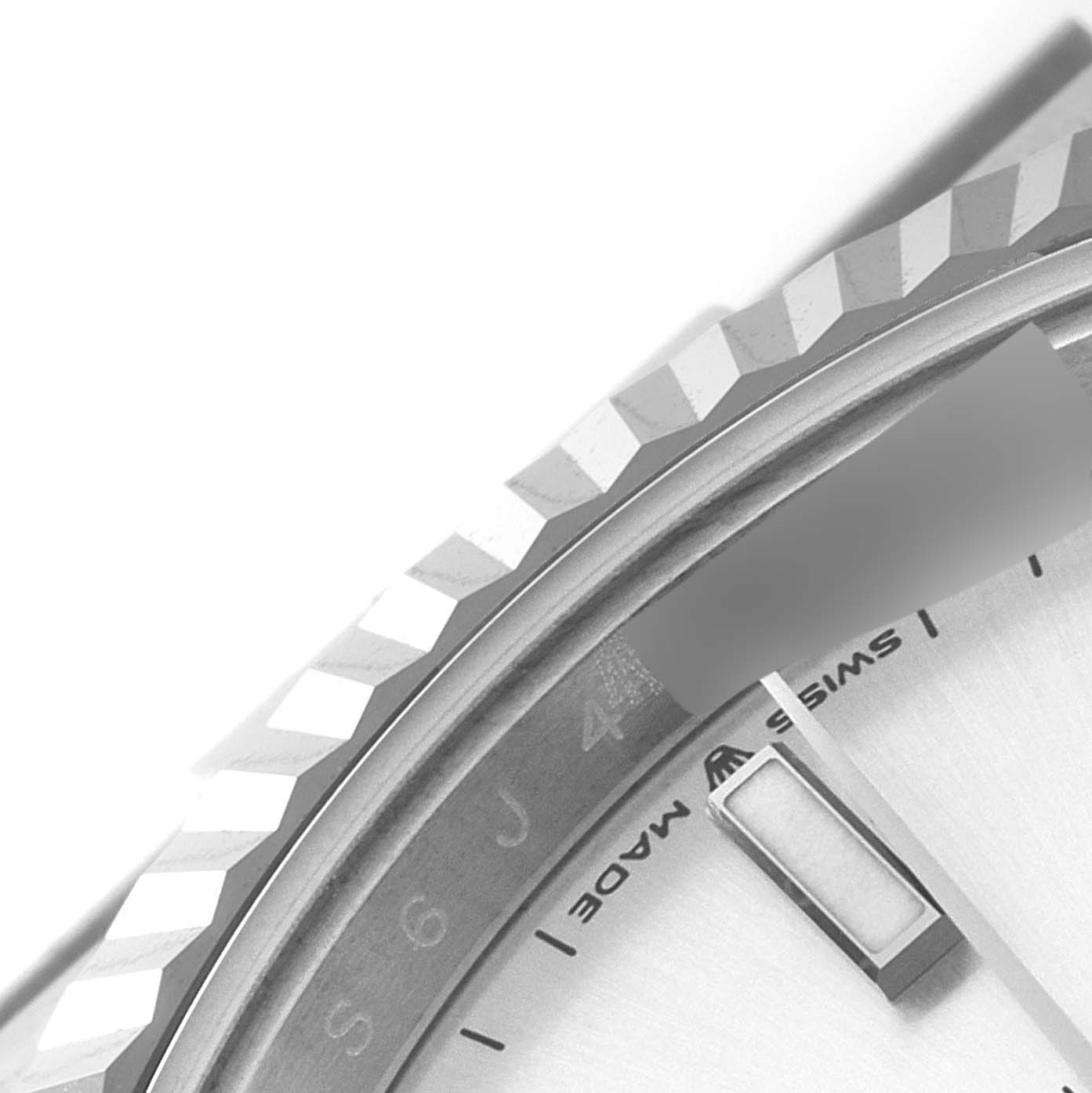 The image shows a close-up of the bezel and part of the dial of a Rolex Datejust 41 126334 Men's Stainless Steel Silver Dial 126334 Men's Stainless Steel Silver Dial watch.