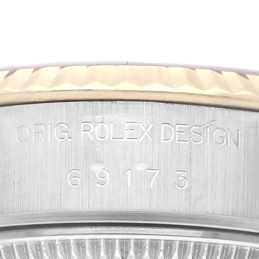 This image shows a close-up of the case side with the engraved serial number on the Rolex Datejust 69173 Women's Steel and Gold (two tone) Champagne Dial 69173 Women's Steel and Gold (two tone) Champagne Dial watch.