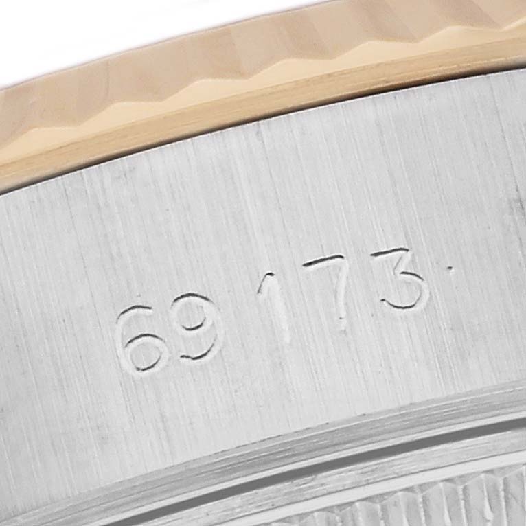 The image shows a close-up of the case part with the etched serial number of a Rolex Datejust 69173 Women's Steel and Gold (two tone) Champagne Dial 69173 Women's Steel and Gold (two tone) Champagne Dial watch.