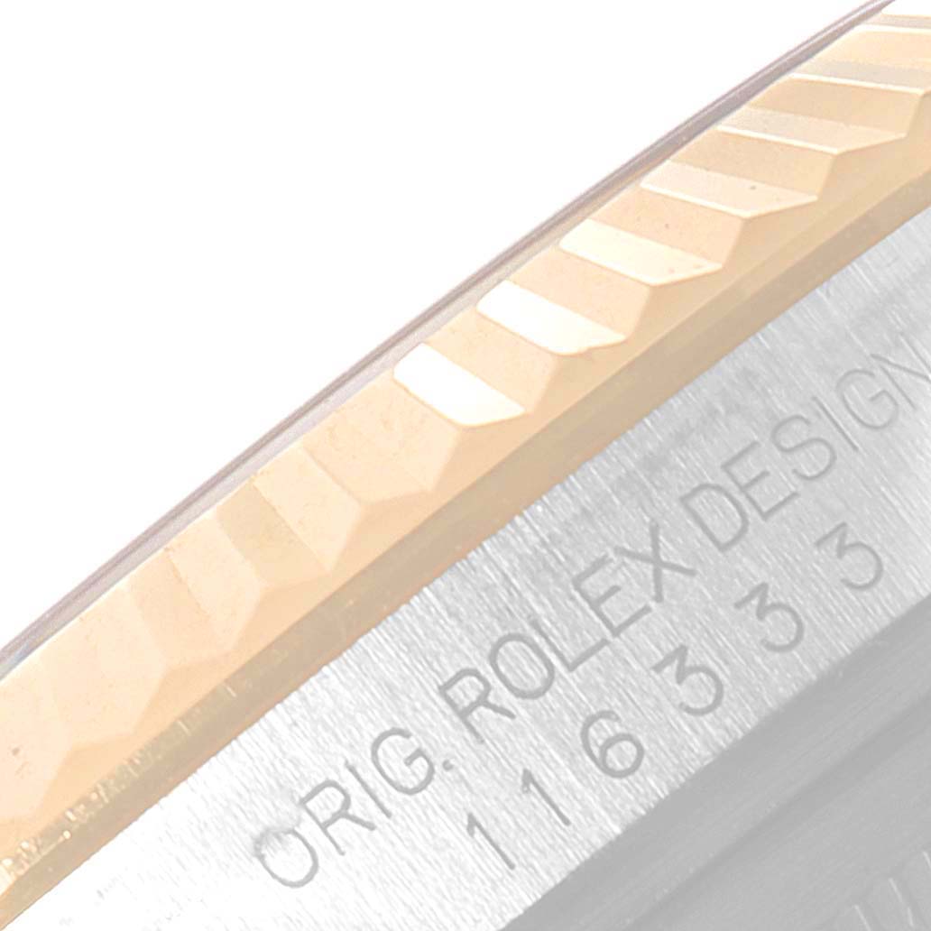 The image shows a close-up of the bezel and part of the case of the Rolex Datejust 41 116333 Men's Steel and Gold (two tone) Grey Dial 116333 Men's Steel and Gold (two tone) Grey Dial watch.