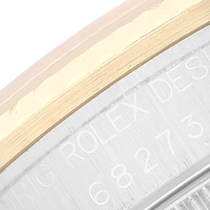 The image shows a close-up of the side engraving and bezel of the Rolex Mid-Size 68273 Women's Steel and Gold (two tone) Silver Dial 68273 Women's Steel and Gold (two tone) Silver Dial watch, highlighting the model number.