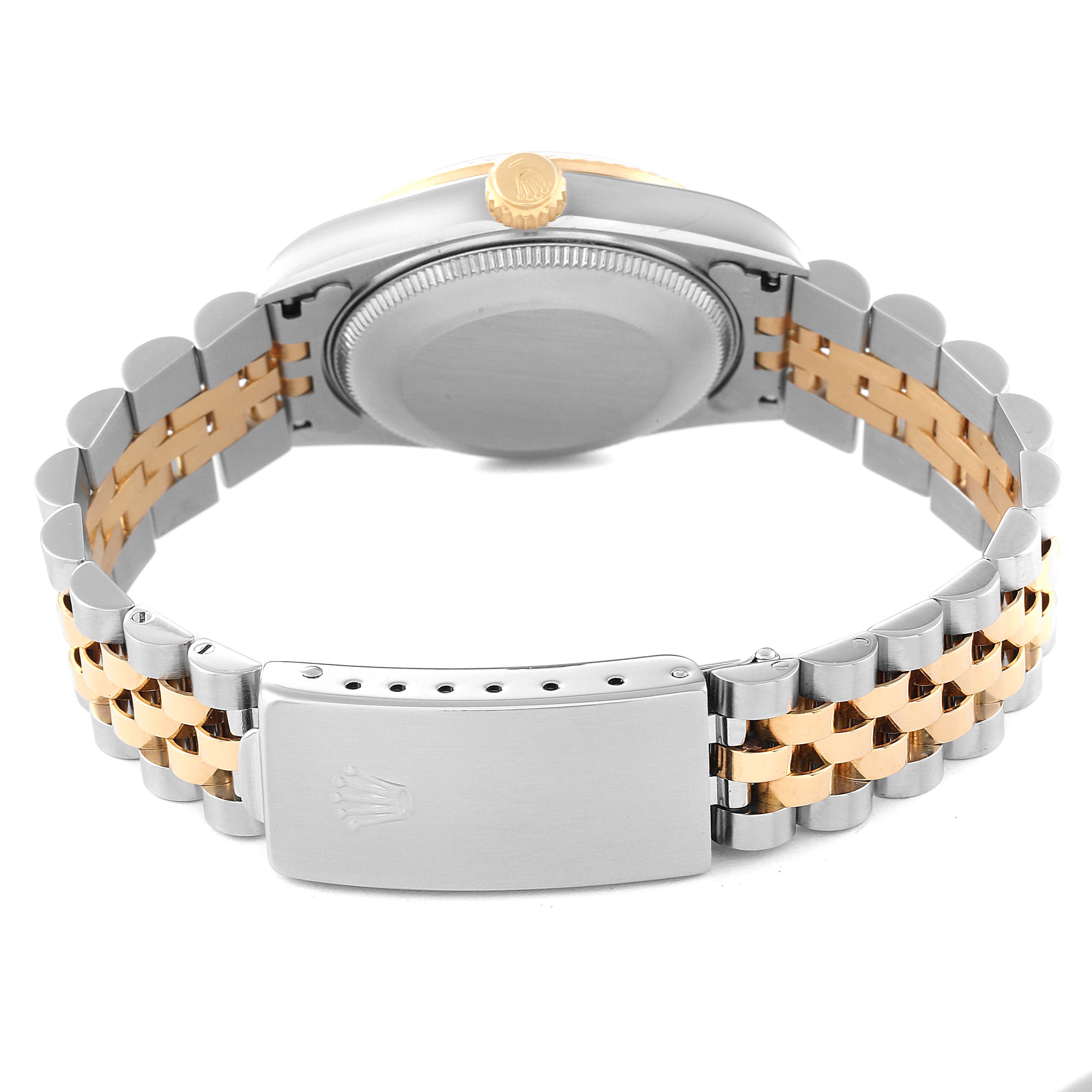 The image shows the back view of a Rolex Mid-Size 68273 Women's Steel and Gold (two tone) Silver Dial 68273 Women's Steel and Gold (two tone) Silver Dial watch, highlighting the stainless steel and gold bracelet and the clasp.