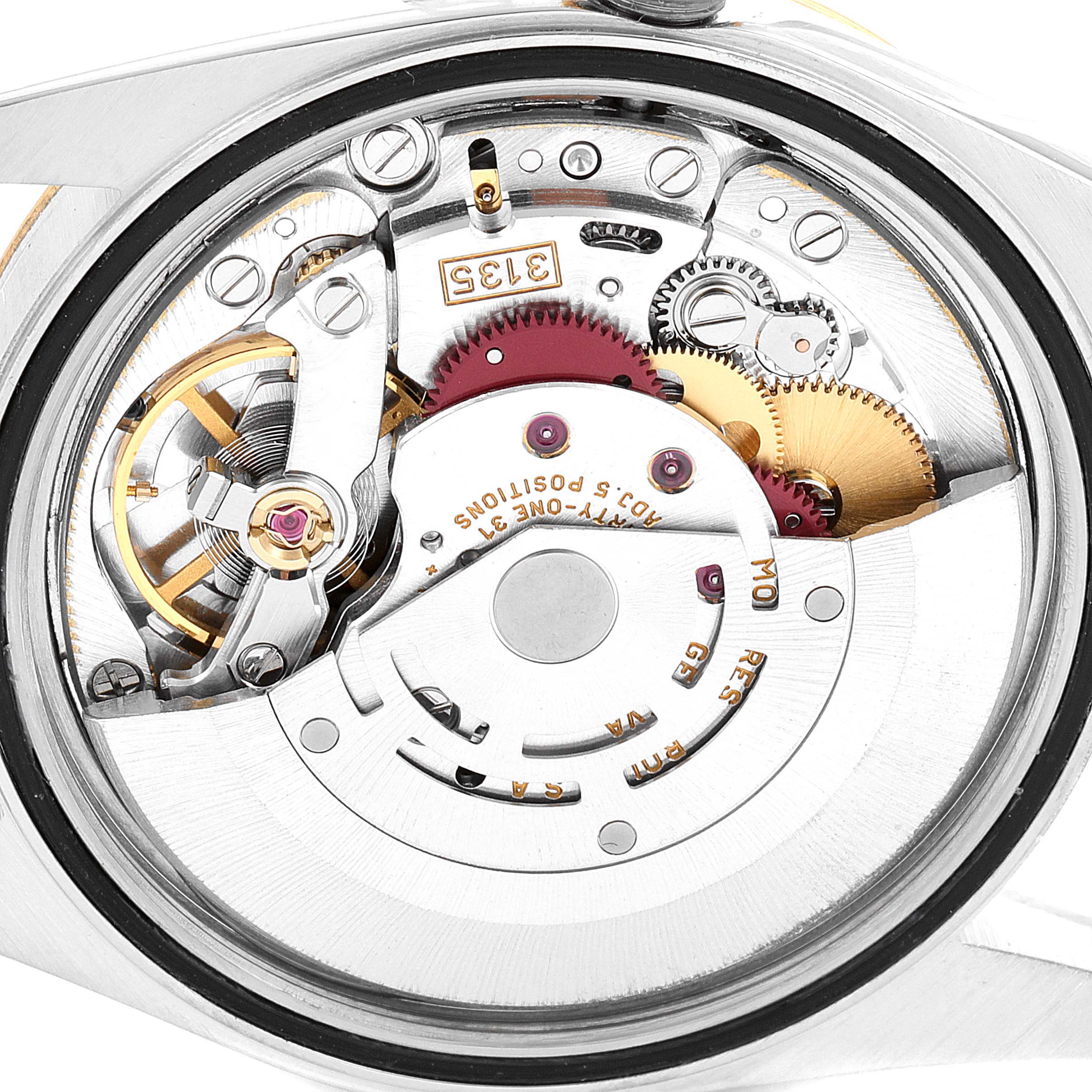 This image shows a close-up view of the Rolex Datejust 16233 Men's Steel and Gold (two tone) Champagne Dial 16233 Men's Steel and Gold (two tone) Champagne Dial watch's movement mechanism.