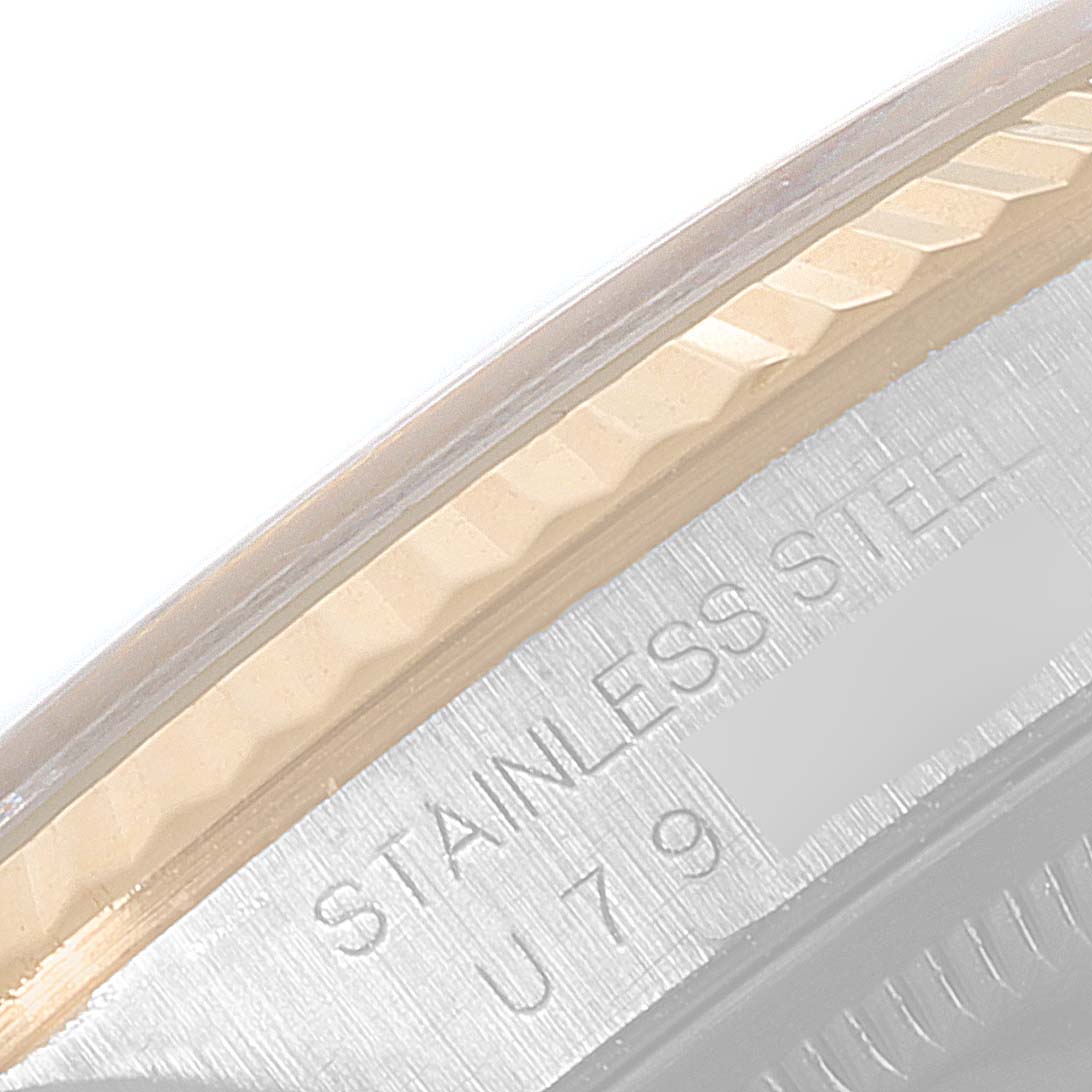 The image shows a close-up of the engraved stainless steel casing on a Rolex Datejust 16233 Men's Steel and Gold (two tone) Champagne Dial 16233 Men's Steel and Gold (two tone) Champagne Dial watch.