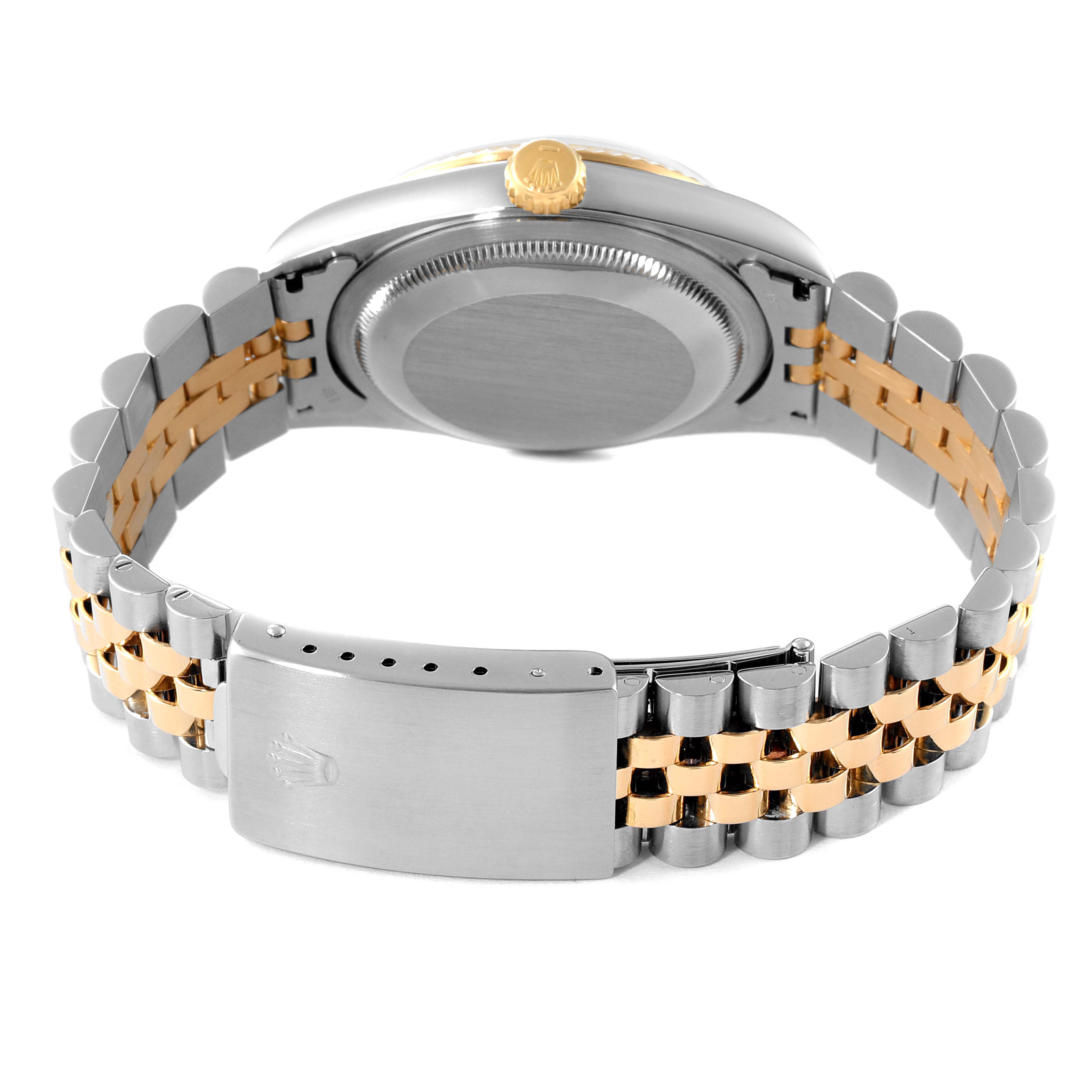 The image shows the back and bracelet of a Rolex Datejust 16233 Men's Steel and Gold (two tone) Champagne Dial 16233 Men's Steel and Gold (two tone) Champagne Dial model, highlighting its clasp and crown.