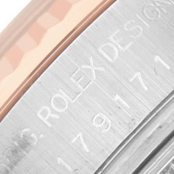 The image shows a close-up of the side of the Rolex Datejust 179171 Women's Steel and Gold (two tone) Pink Dial 179171 Women's Steel and Gold (two tone) Pink Dial, focusing on its engraved design marking.