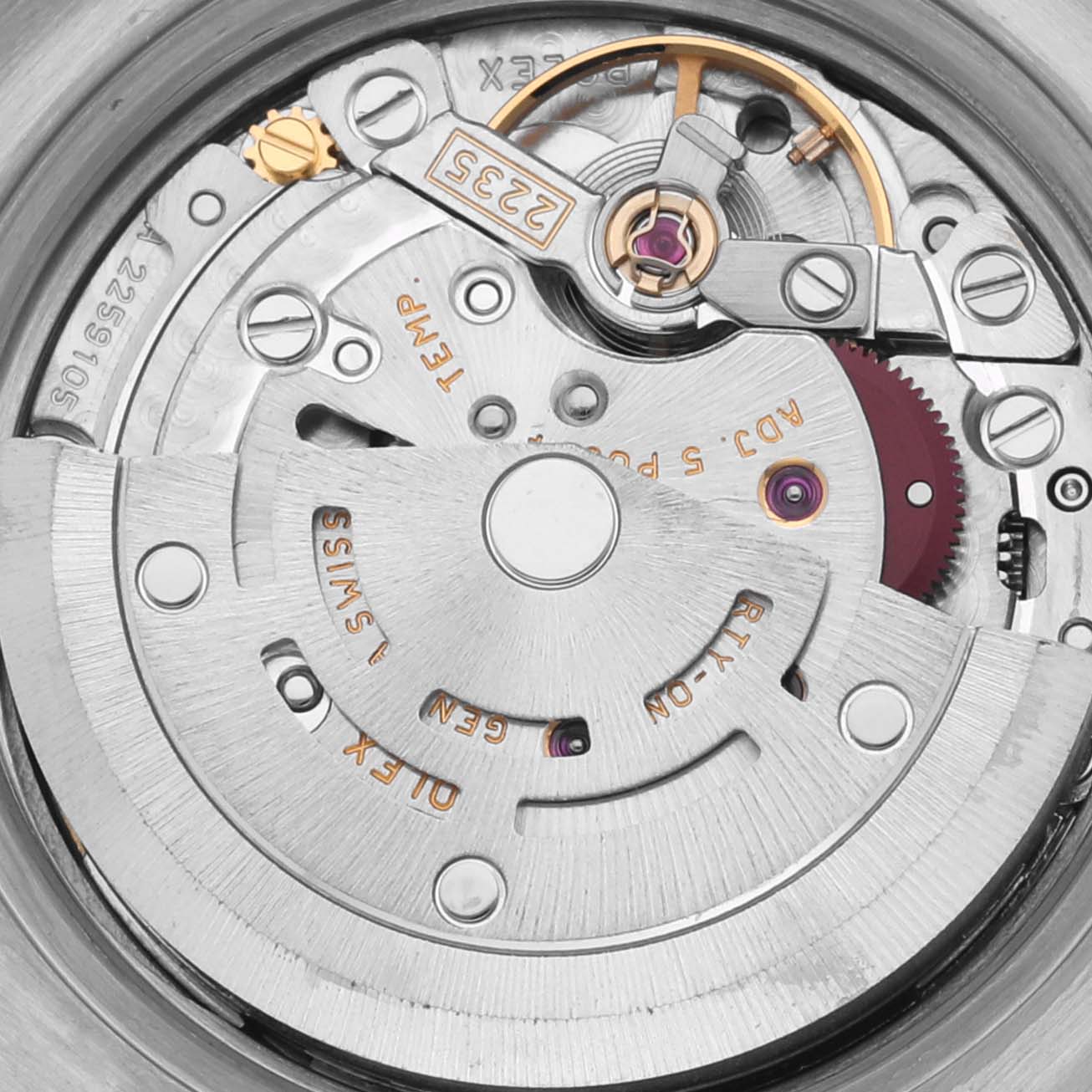 The image shows the movement of a Rolex Datejust 179171 Women's Steel and Gold (two tone) Pink Dial 179171 Women's Steel and Gold (two tone) Pink Dial watch, highlighting the rotor, gears, and intricate components.