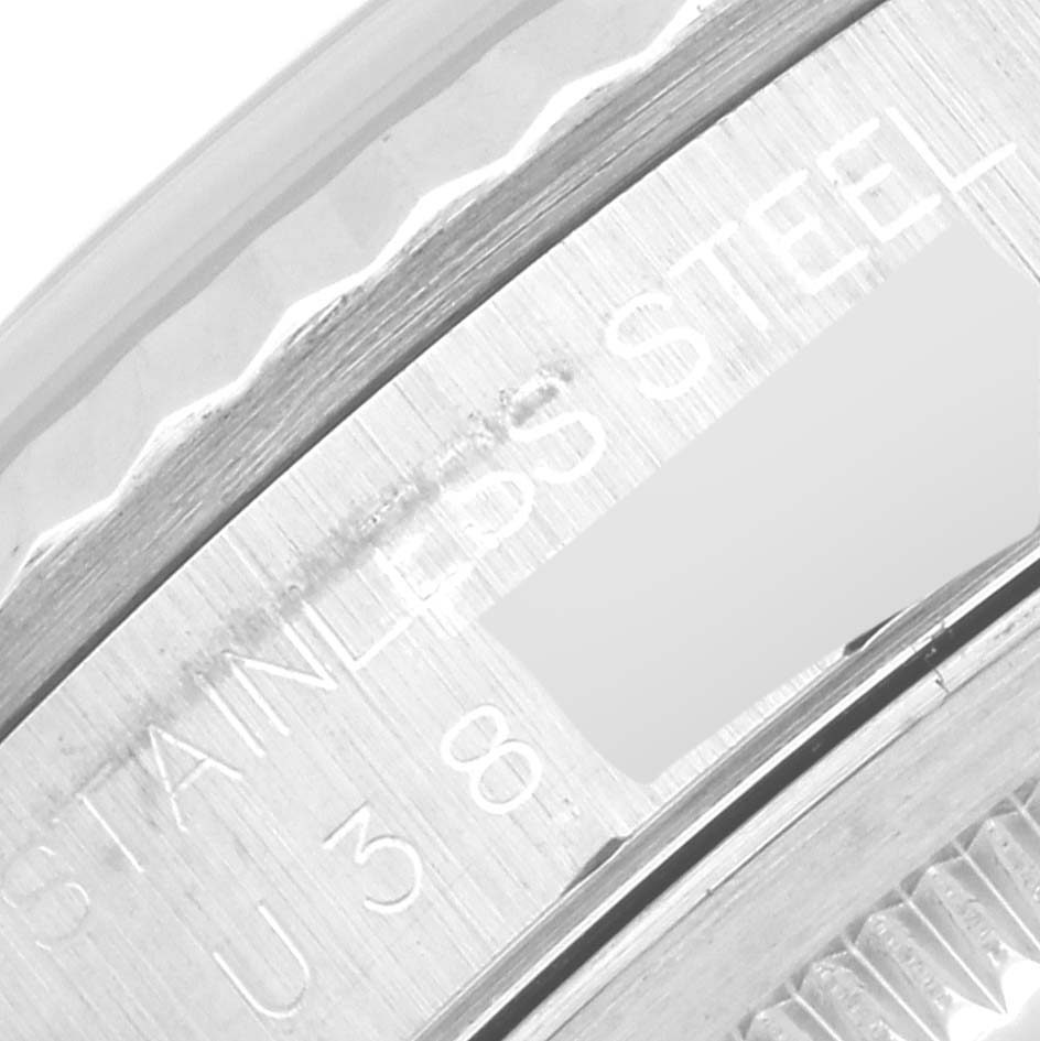 This image shows a close-up of the engraving on the case side of a Rolex Datejust 16234 Men
s Stainless Steel Silver Dial 16234 Men
s Stainless Steel Silver Dial watch, emphasizing the "STAINLESS STEEL" text.