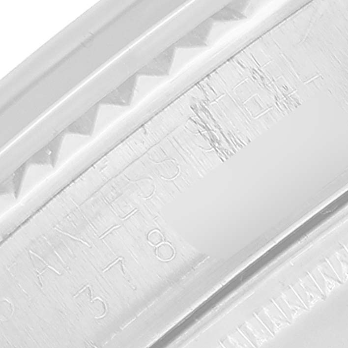 This close-up image shows the side of the bezel and engraved serial number of the Vintage Collection model by Rolex.