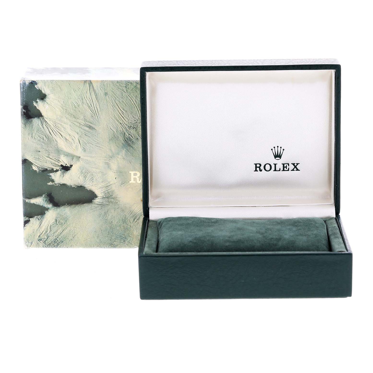 The image shows an open Rolex Datejust 79174 Women
s Stainless Steel Silver Dial 79174 Women
s Stainless Steel Silver Dial watch box with a green cushion inside and the Rolex logo on the interior lid.
