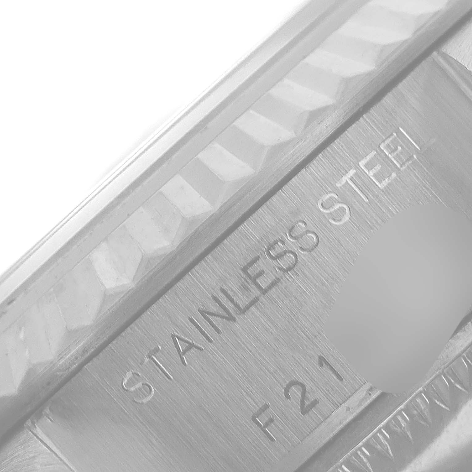 The image shows a close-up angle of the bezel and case of a Rolex Datejust 79174 Women
s Stainless Steel Silver Dial 79174 Women
s Stainless Steel Silver Dial, highlighting the "Stainless Steel" inscription.