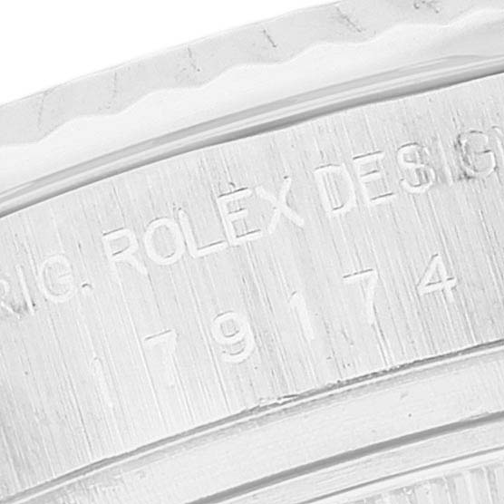 The image shows the engraved side of the bezel and case of the Rolex Datejust 179174 Women's Stainless Steel White Dial 179174 Women's Stainless Steel White Dial watch.