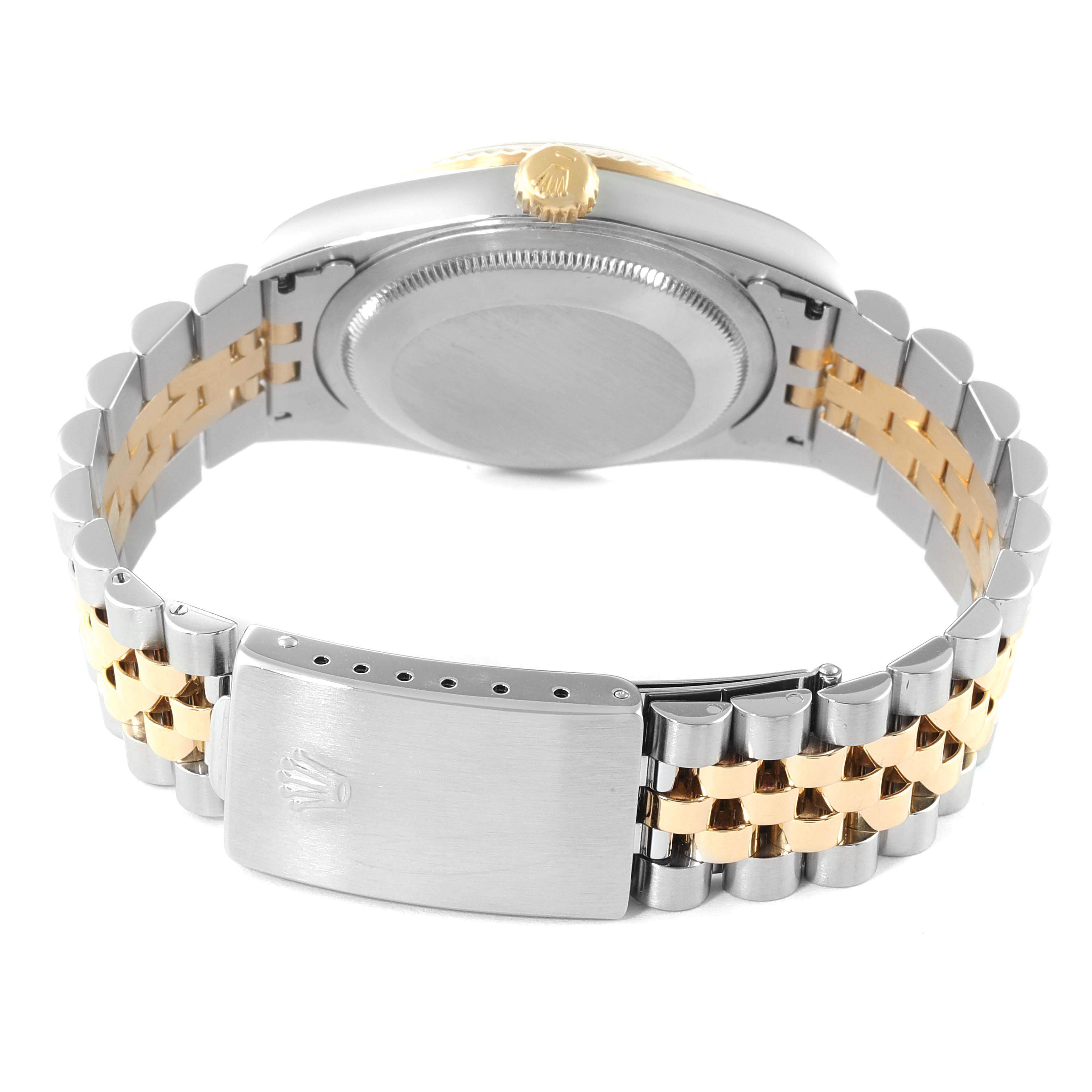 The image shows the back of a Rolex Datejust 16233 Men's Steel and Gold (two tone) Champagne Dial 16233 Men's Steel and Gold (two tone) Champagne Dial watch, focusing on the clasp and the bracelet.