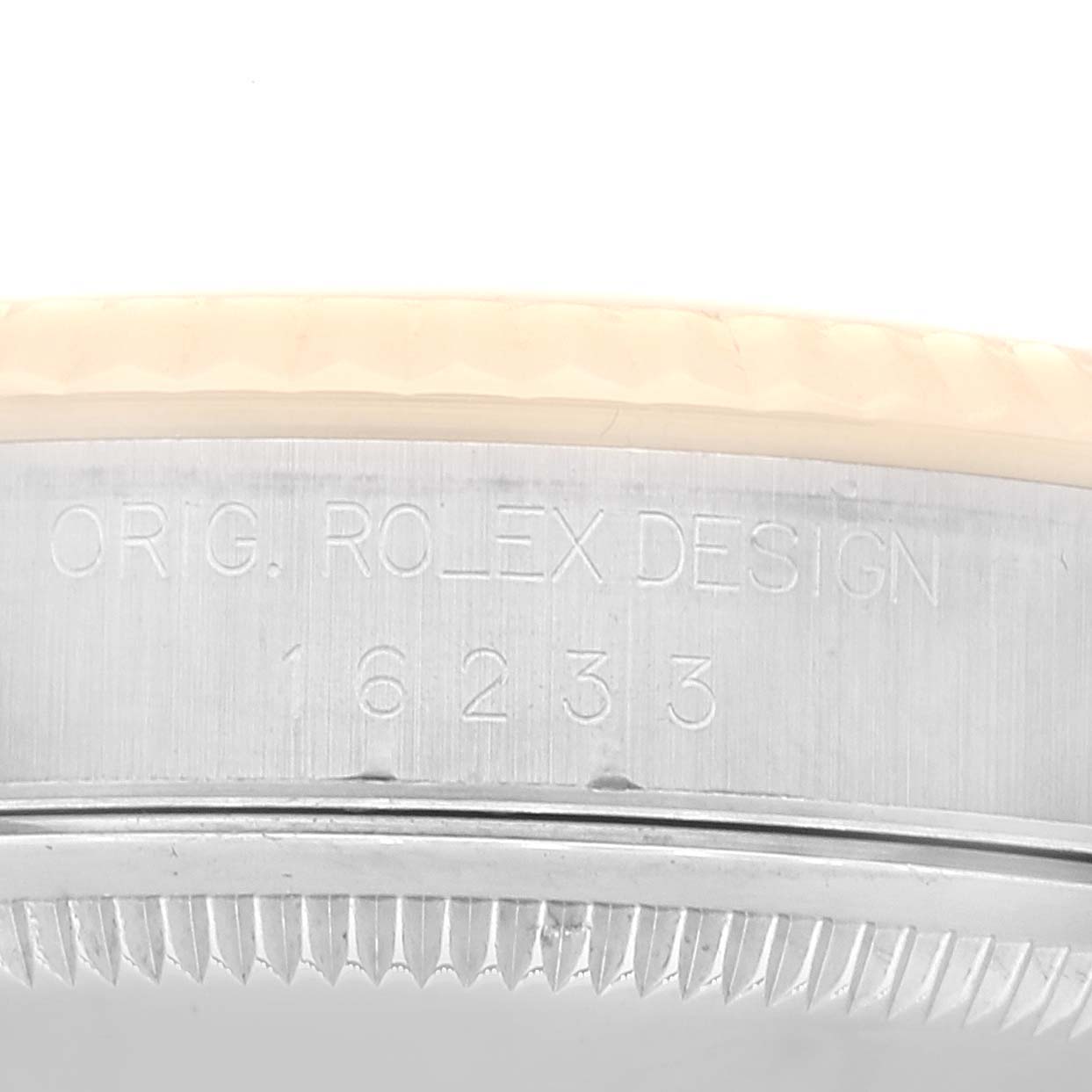 This image shows the side of the Rolex Datejust 16233 Men's Steel and Gold (two tone) Champagne Dial 16233 Men's Steel and Gold (two tone) Champagne Dial watch, highlighting its model number and "ORIG. ROLEX DESIGN" engraving.
