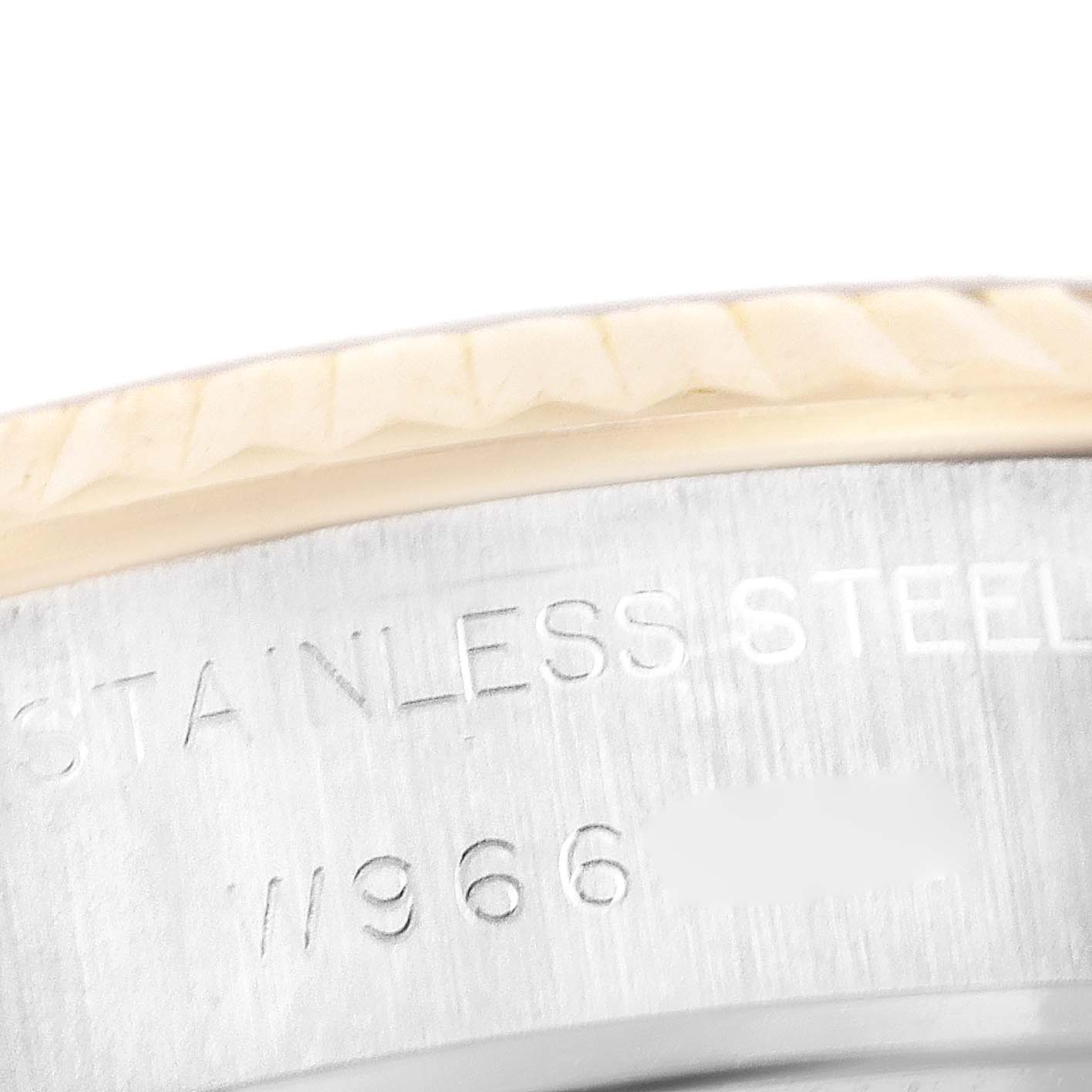 This image shows a close-up of the side of the Rolex Datejust 69173 Women's Steel and Gold (two tone) Mother of Pearl Dial 69173 Women's Steel and Gold (two tone) Mother of Pearl Dial watch bezel and the stainless steel engraving.