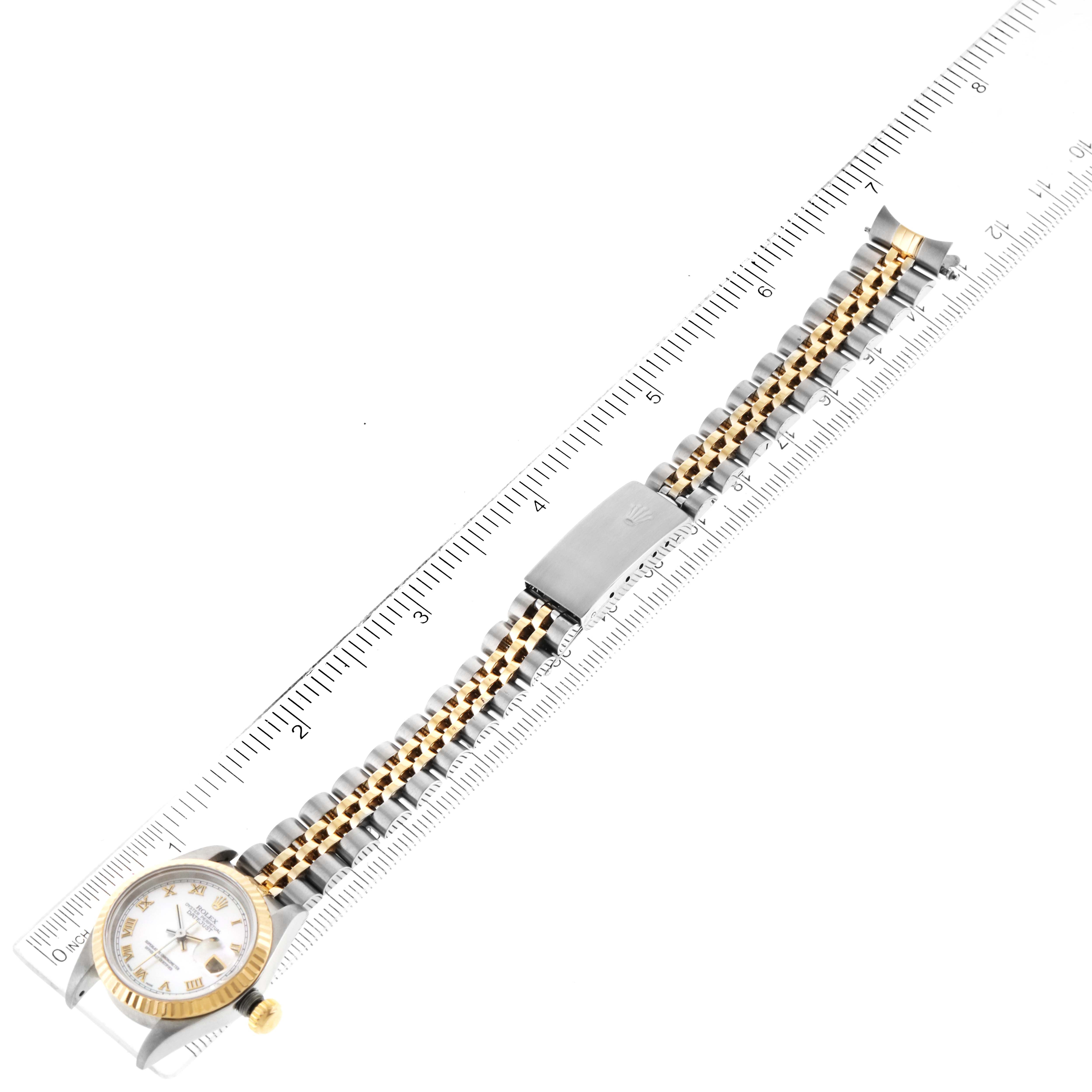 The image shows a Rolex Datejust 69173 Women's Steel and Gold (two tone) Mother of Pearl Dial 69173 Women's Steel and Gold (two tone) Mother of Pearl Dial model watch laid flat with its band extended alongside a ruler, displaying the watch's size and bracelet details.