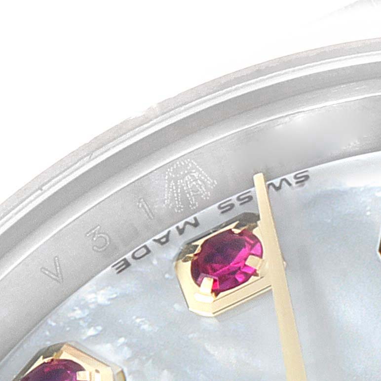 This is a macro close-up of the dial and hour marks on a Rolex Datejust 179173 Women's Steel and Gold (two tone) Mother of Pearl Dial 179173 Women's Steel and Gold (two tone) Mother of Pearl Dial, showing "SWISS MADE" text and gem markers.