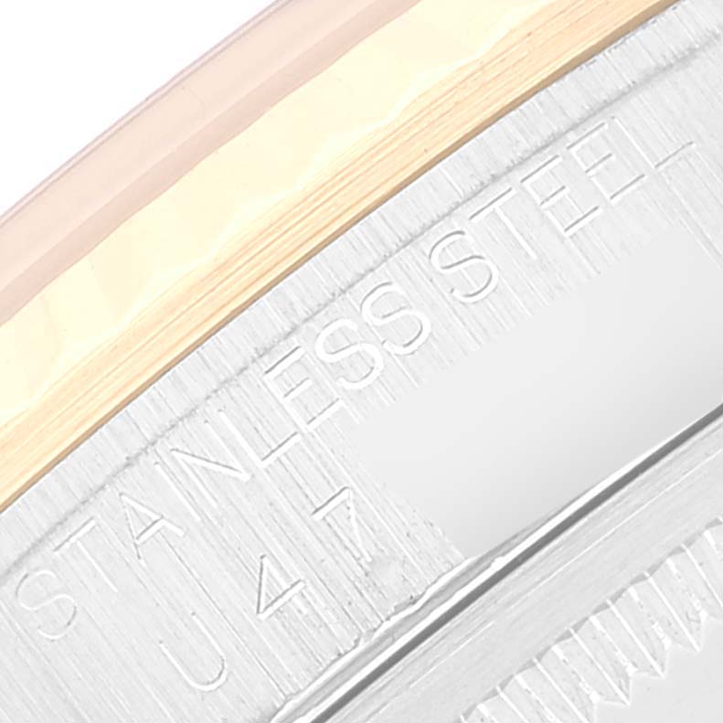 The image shows a close-up view of the engraved stainless steel case back with the markings "STAINLESS STEEL" on a Rolex Datejust 16233 Men's Steel and Gold (two tone) Mother of Pearl Dial 16233 Men's Steel and Gold (two tone) Mother of Pearl Dial watch.