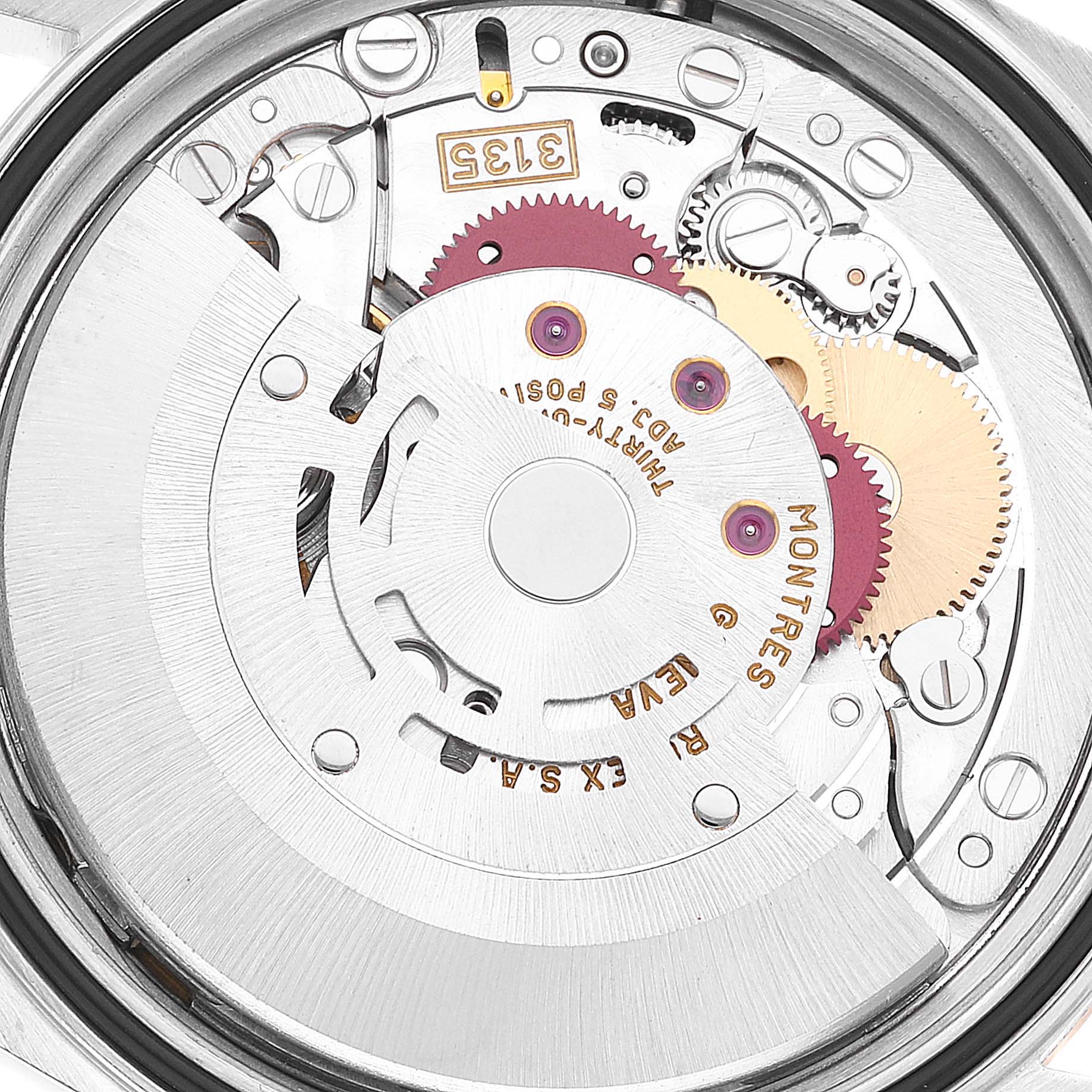 This image shows a close-up of the Rolex Datejust 16233 Men's Steel and Gold (two tone) Mother of Pearl Dial 16233 Men's Steel and Gold (two tone) Mother of Pearl Dial movement, displaying internal gears and intricate mechanical details.