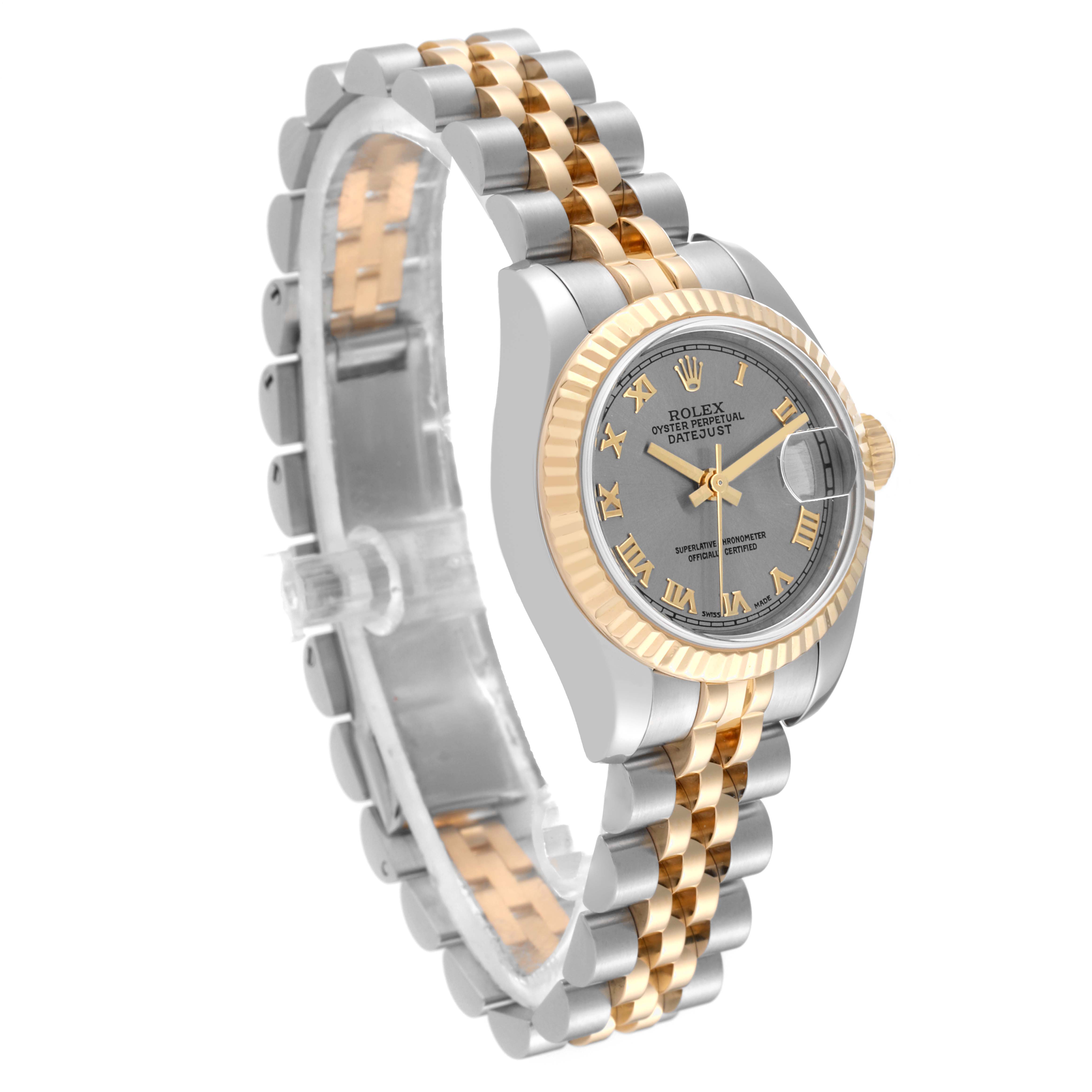The Rolex Datejust 179173 Women's Steel and Gold (two tone) Grey Dial watch is shown at an angled side view, highlighting the two-tone bracelet, gold fluted bezel, and grey dial.