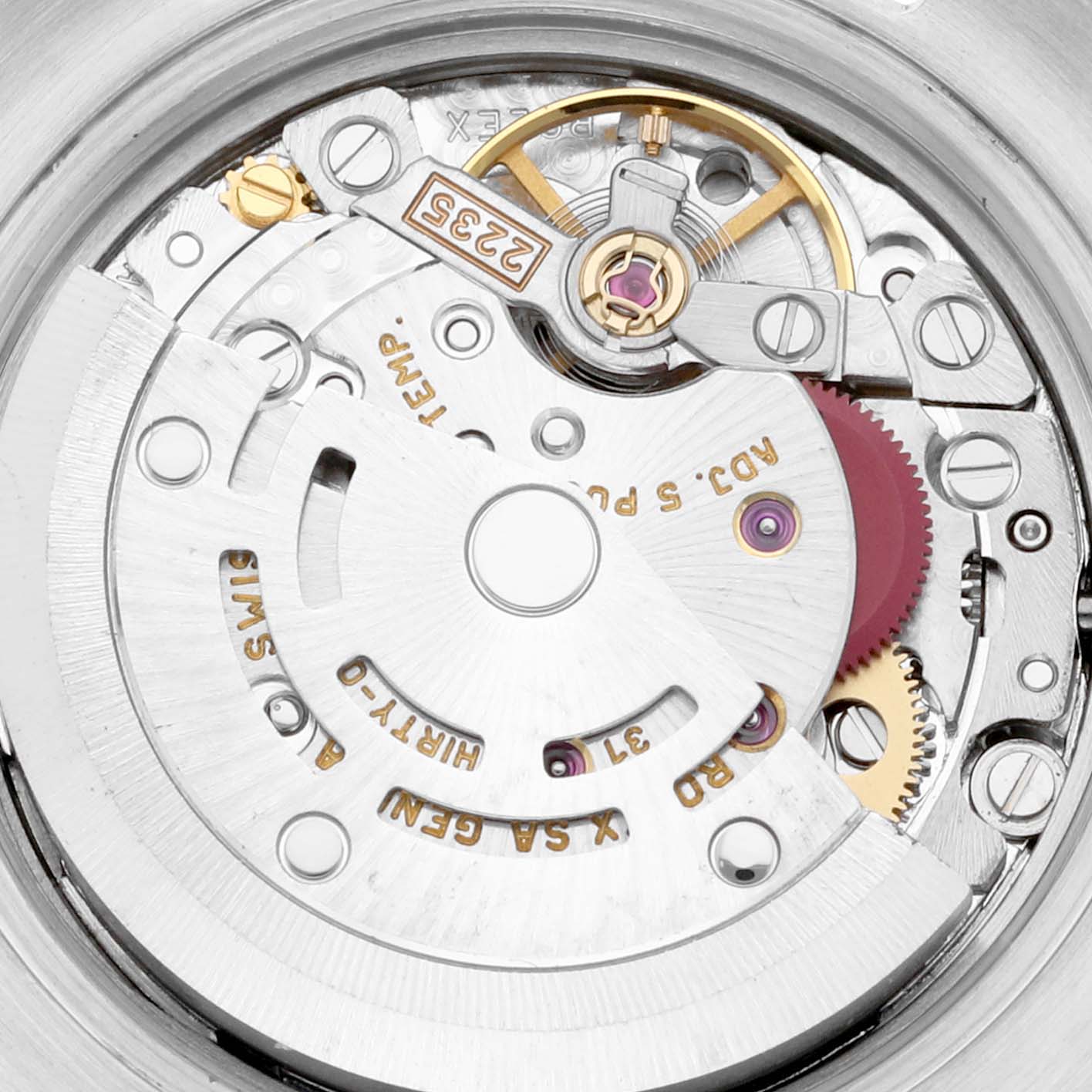 The image shows the movement mechanism of a Rolex Datejust 179173 Women's Steel and Gold (two tone) Grey Dial, highlighting gears and the rotor from a top-down angle.
