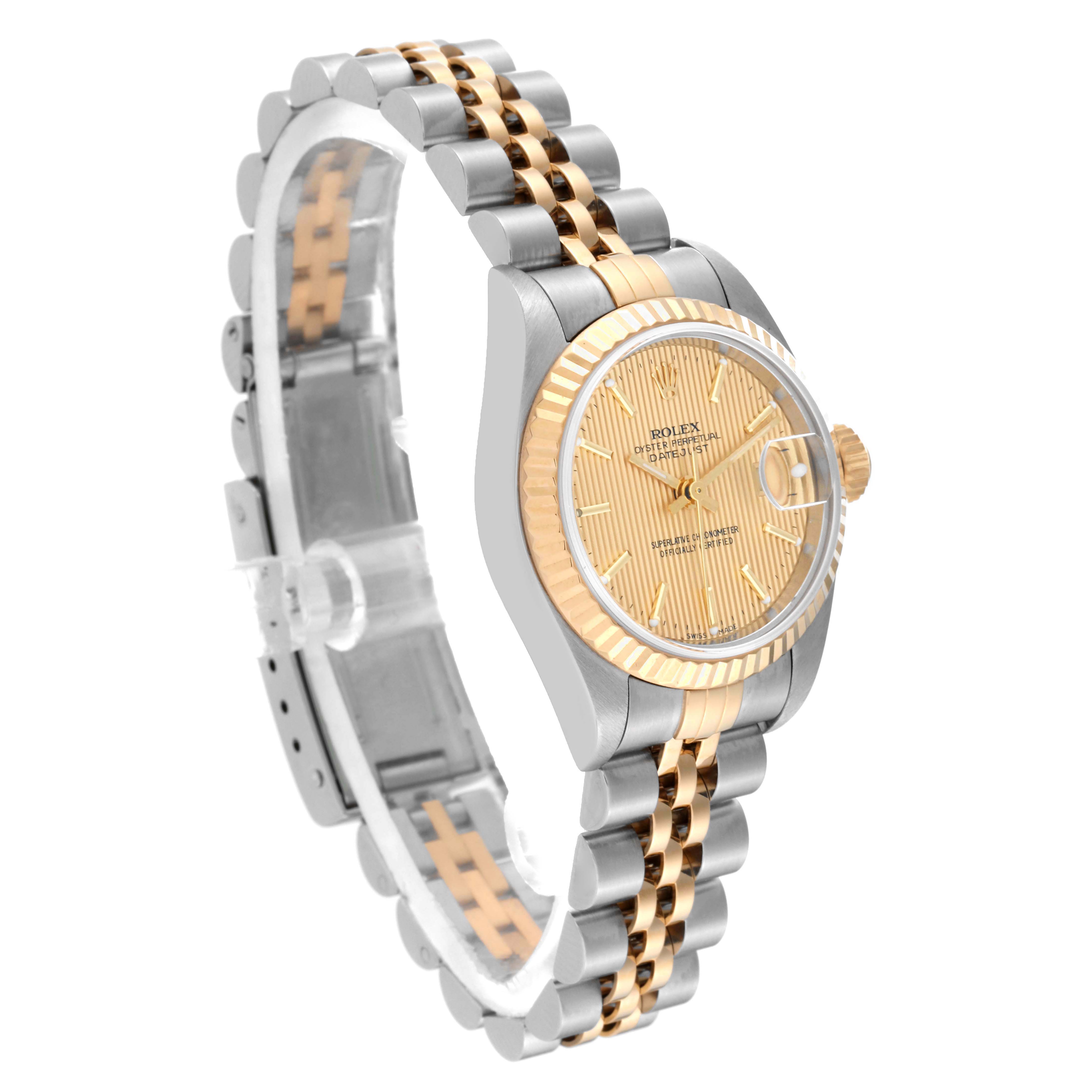 The image shows a side angle of the Rolex Datejust 79173 Women's Steel and Gold (two tone) Champagne Dial 79173 Women's Steel and Gold (two tone) Champagne Dial watch, highlighting its gold dial, fluted bezel, and two-tone Jubilee bracelet.